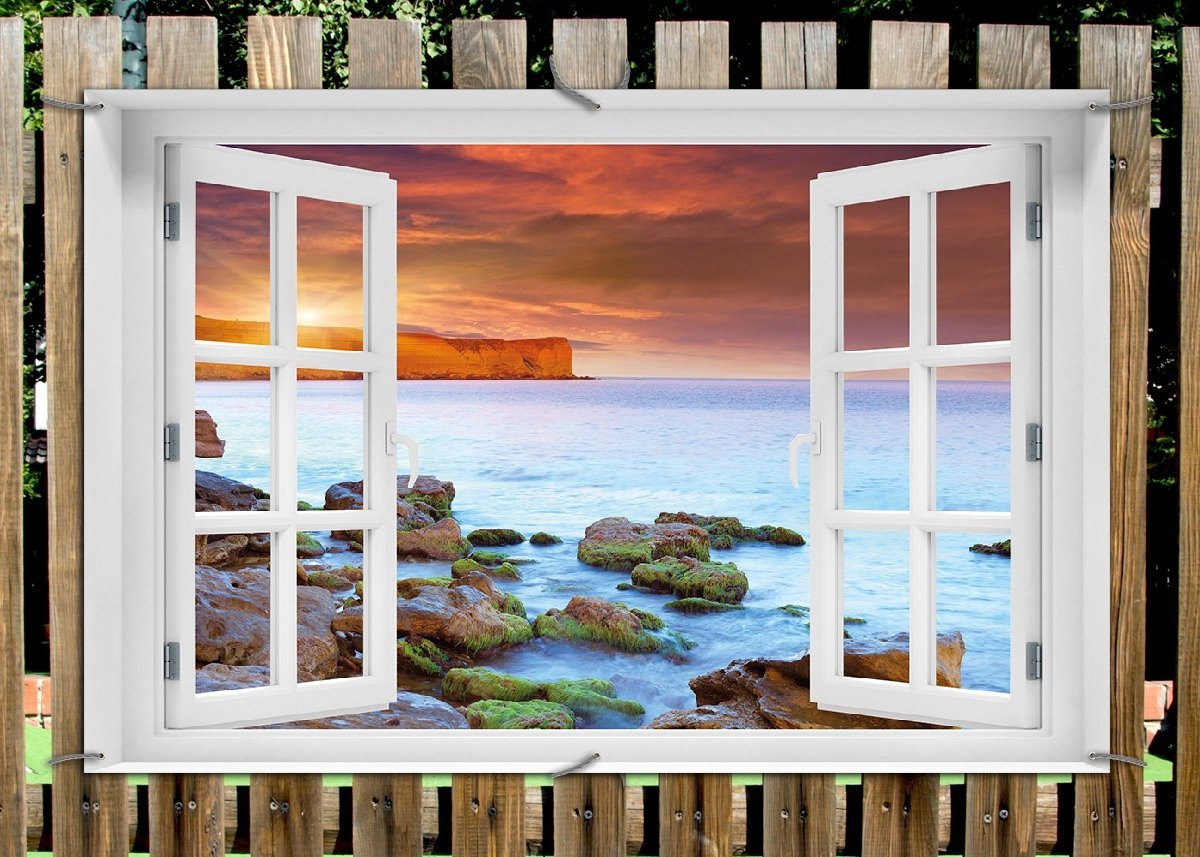 Thumbnail - Wallario Sichtschutzzaunmatten Sonnenaufgang am Meer mit Landzunge und Felsen im Wasser, mit Fenster-Illusion