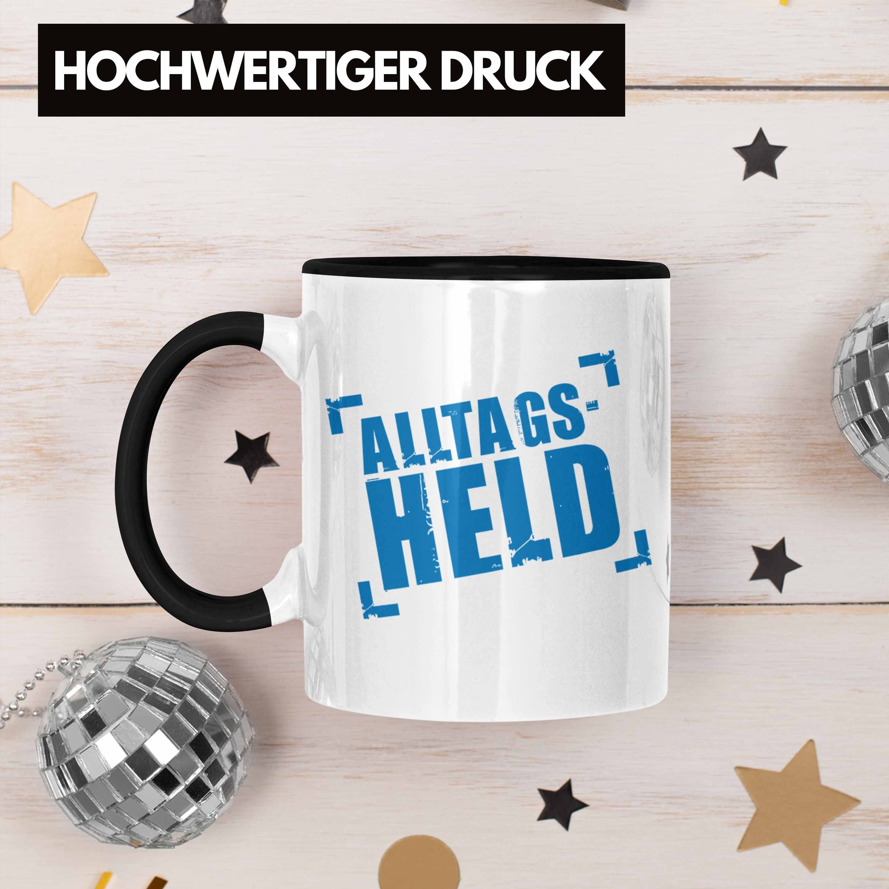Trendation Mann Schwarz Lustig Männer Lustige Alltags-Held Tasse Kollegin Trendation - Kaffeebecher Kollege Büro Tasse Kaffeetasse