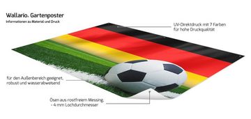 Wallario Sichtschutzzaunmatten Fußball vor einer Deutschlandflagge