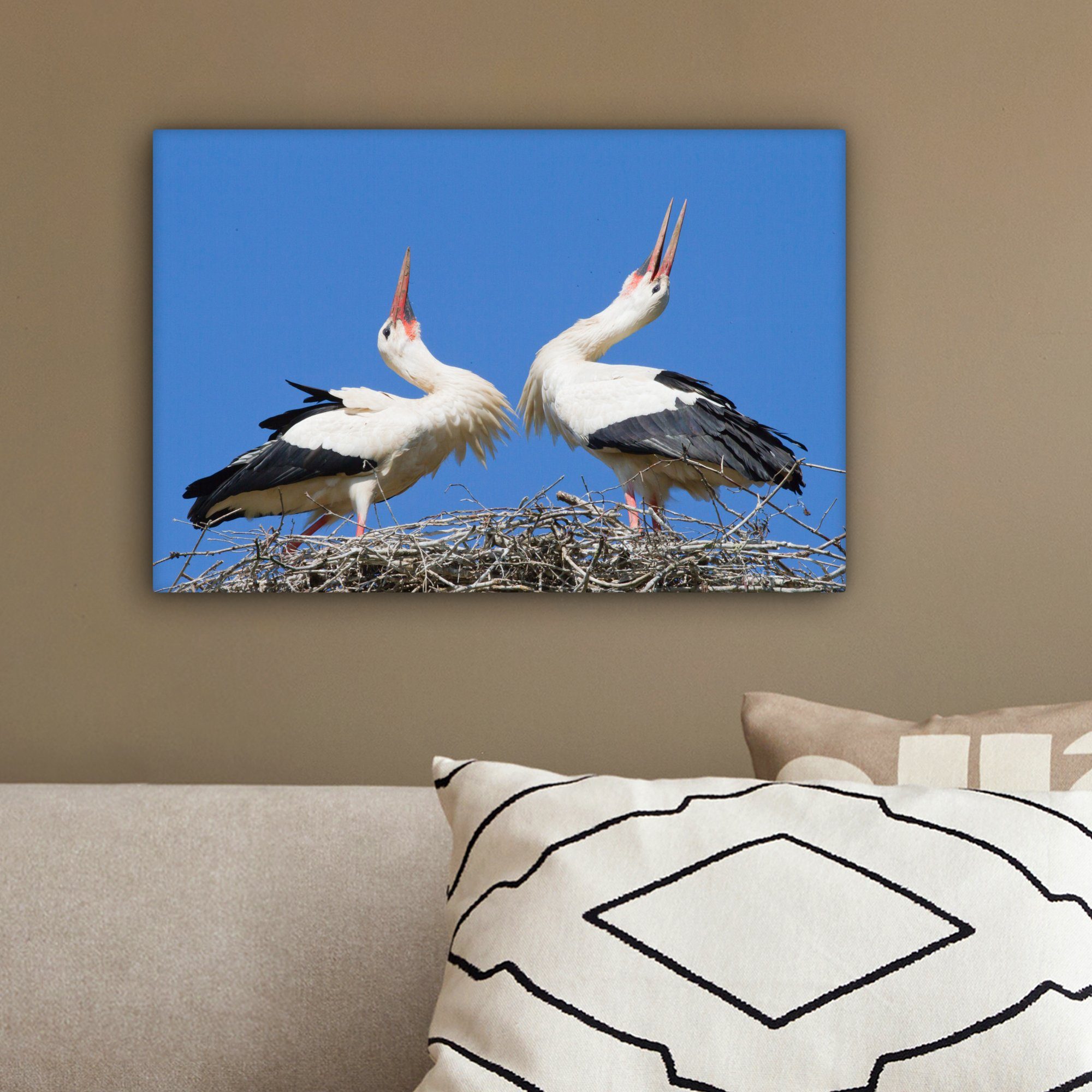 OneMillionCanvasses® Leinwandbild Atemberaubendes Bild von Störchen Wandbild 30x20 Wanddeko, in Leinwandbilder, cm St), Nest, ihrem zwei (1 Aufhängefertig