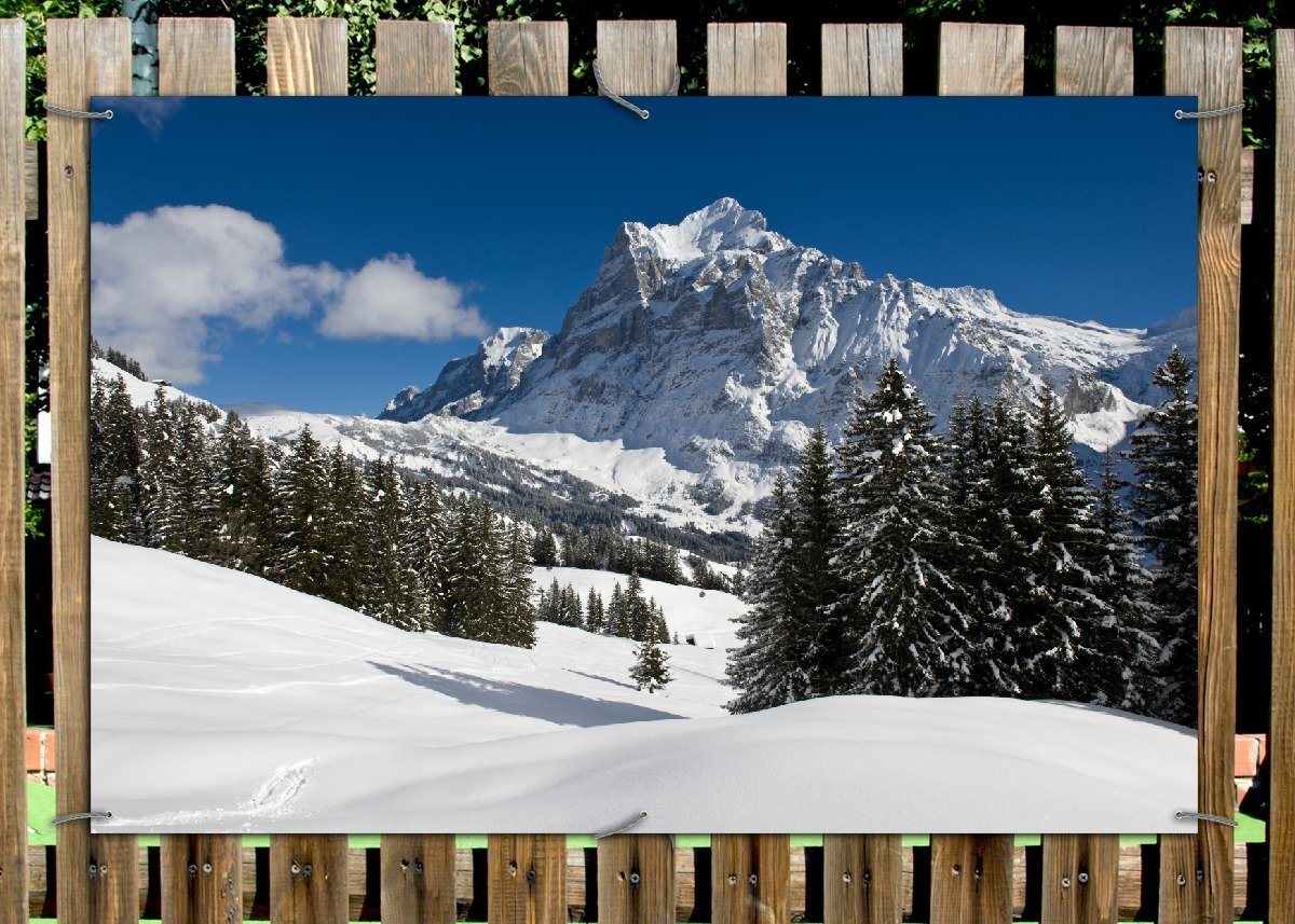 Thumbnail - Wallario Sichtschutzzaunmatten Verschneiter Berghang unter blauem Himmel