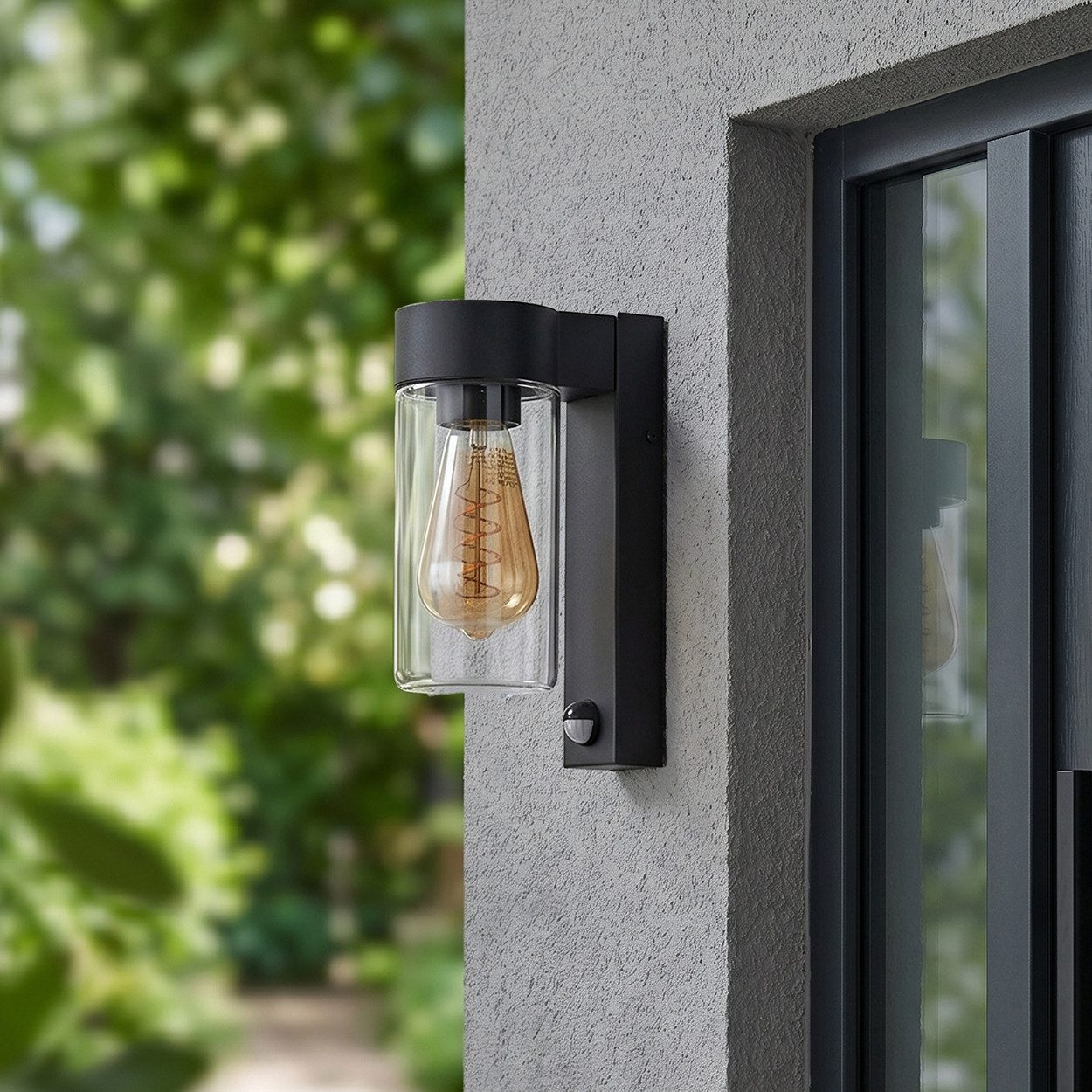 hofstein Außen-Wandleuchte Außenwandlampe mit Bewegungsmelder aus Metall/Glas in Schwarz/Klar, ohne Leuchtmittel, Leuchte im Industrial-Design für Garten/Terrasse/Hof, E27, IP44