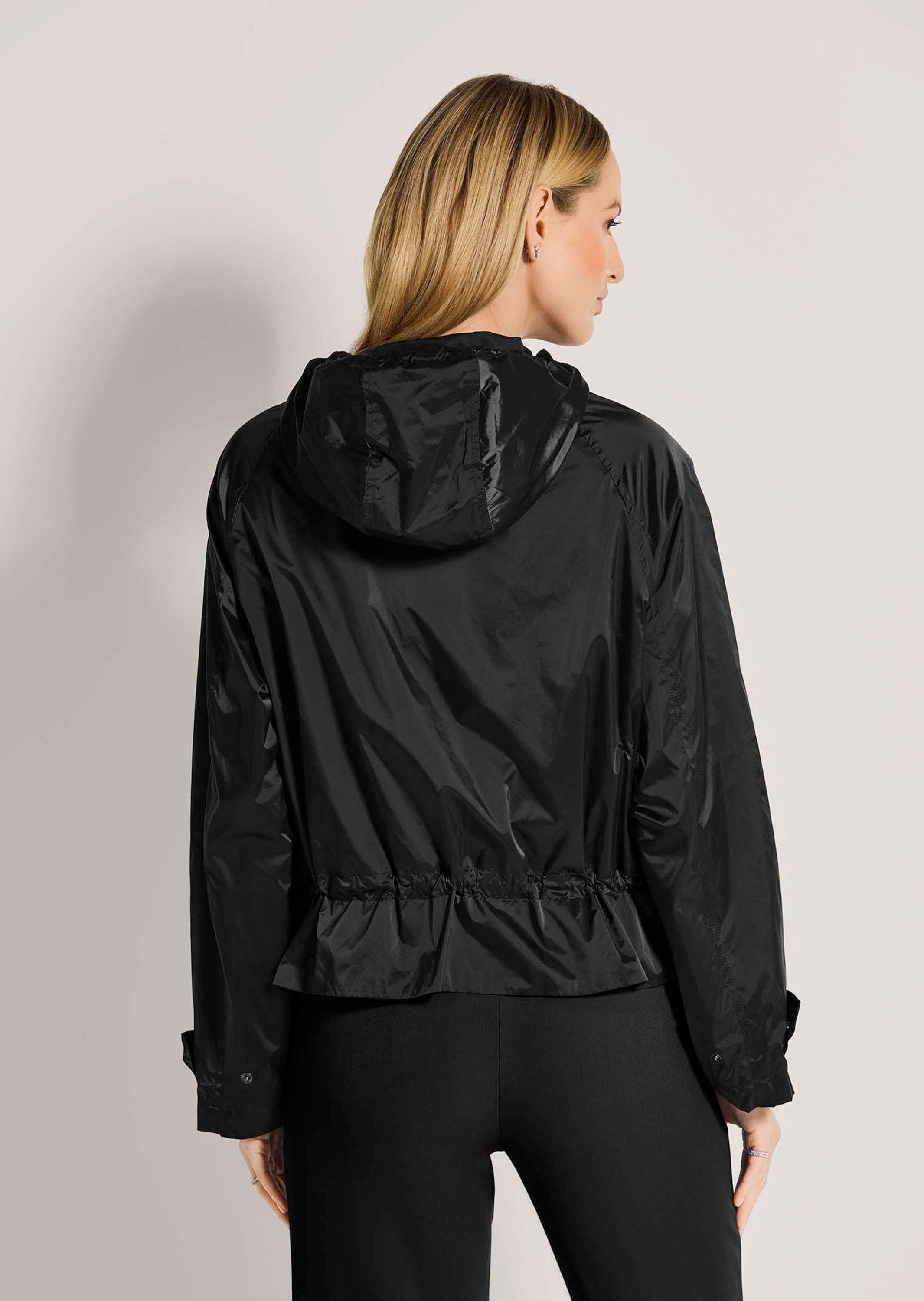 MADELEINE Outdoorjacke Outdoorjacke mit Kapuze, Raglanärmel Unifarbenes Design, variabler Kragen, verdeckter Reißverschluss