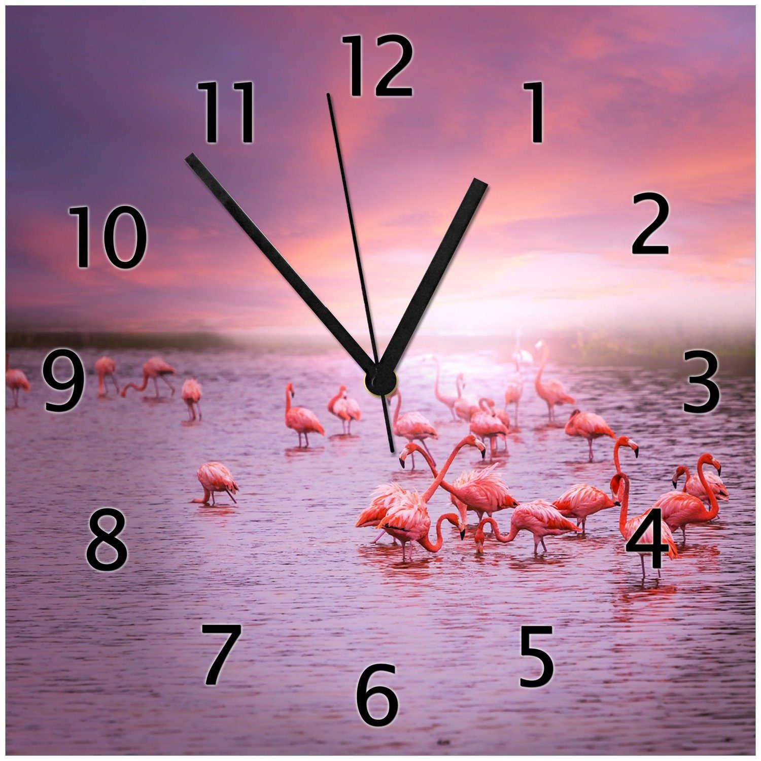 Wallario Wanduhr Rosa Flamingos (Glasuhr) Sonnenuntergang bei