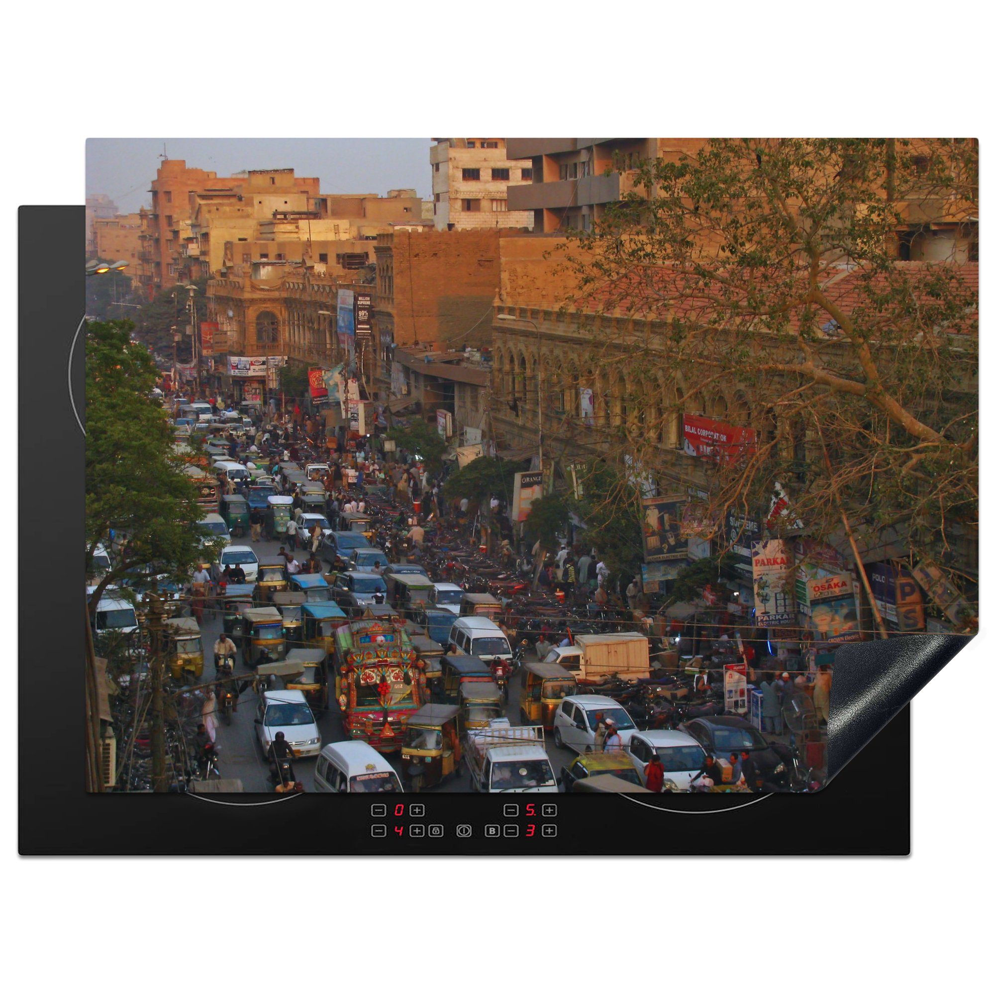 MuchoWow Herdblende-/Abdeckplatte Schwerer Verkehr auf den Straßen von Karatschi, Vinyl, (1 tlg), 70x52 cm, Mobile Arbeitsfläche nutzbar, Ceranfeldabdeckung