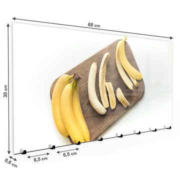 Primedeco Garderobenpaneel Magnetwand und Memoboard aus Glas Bananen auf Brett