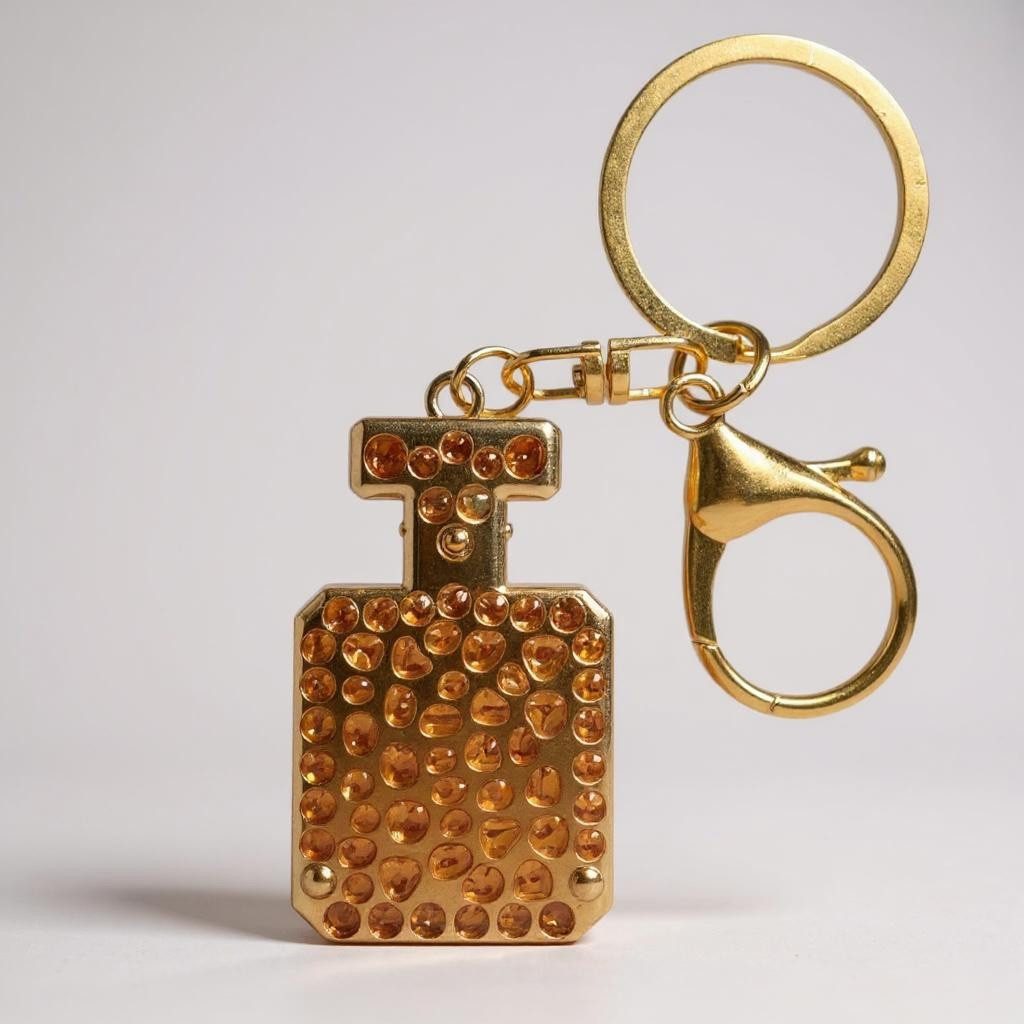 what the shop Schlüsselanhänger Taschenanhänger Parfum Look Gold mit Krista günstig online kaufen