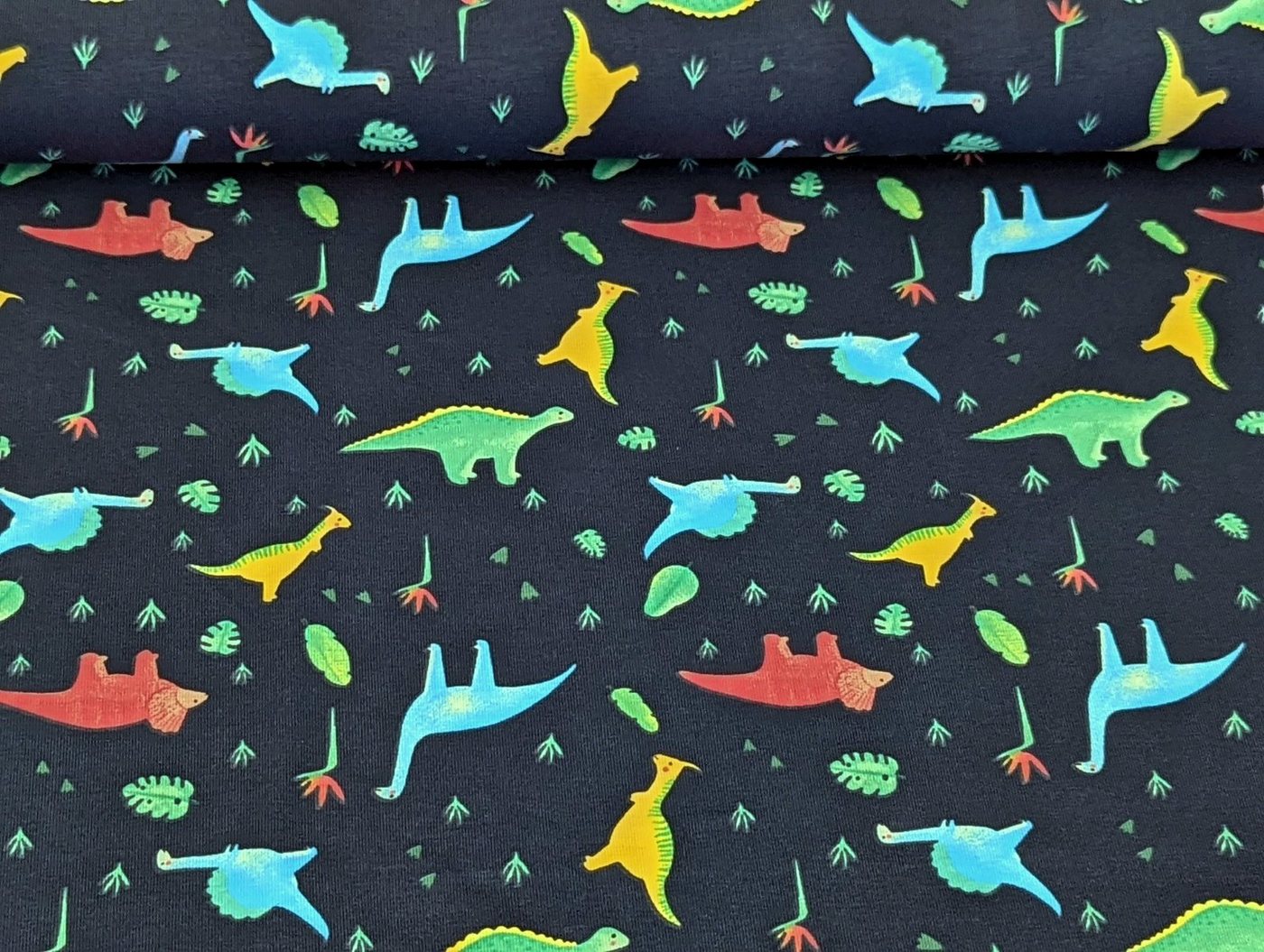 Thumbnail - Corileo Stoff Baumwolljersey Kleine Neon Dinos auf Dunkelblau Stoff