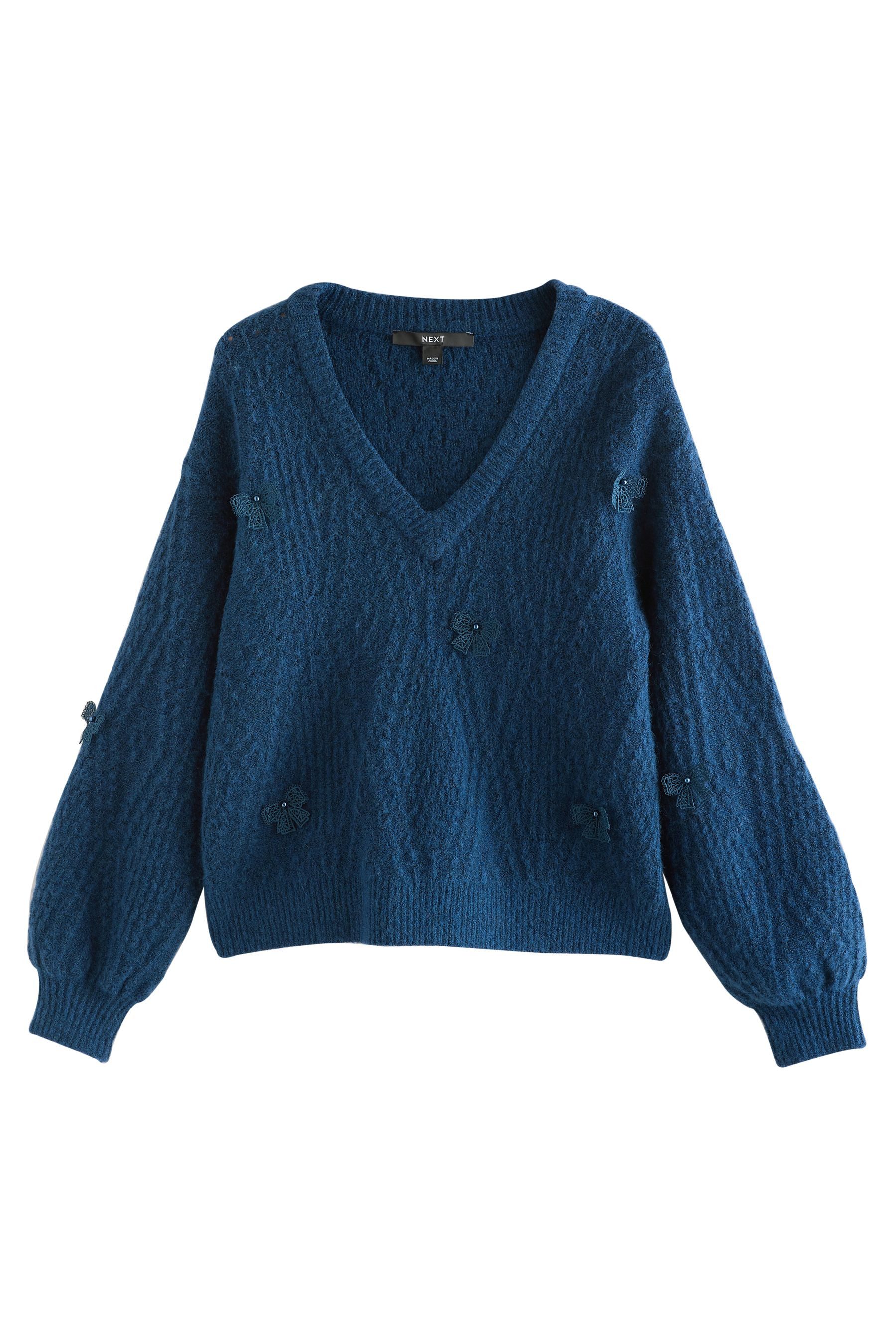 Next V-Ausschnitt-Pullover Argyle-Pullover mit V-Ausschnitt und Schleife (1-tlg)