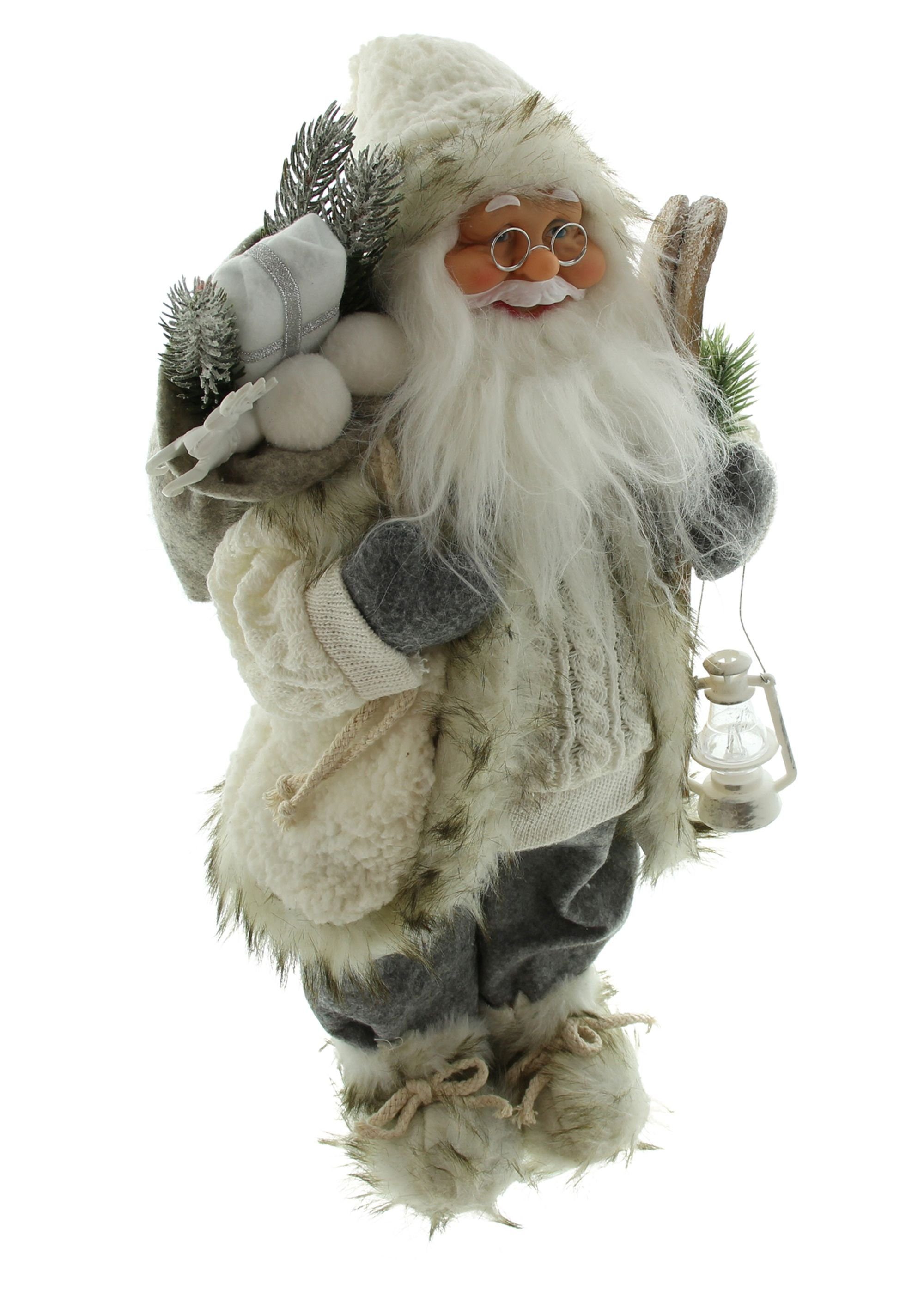 Dekoleidenschaft Weihnachtsmann "Winter" 46 cm Laterne & (1 Claus mit Ski Santa Figur St), hoch, Christkind, Nikolaus Weihnachtsdeko Deko Weihnachtsmannfigur