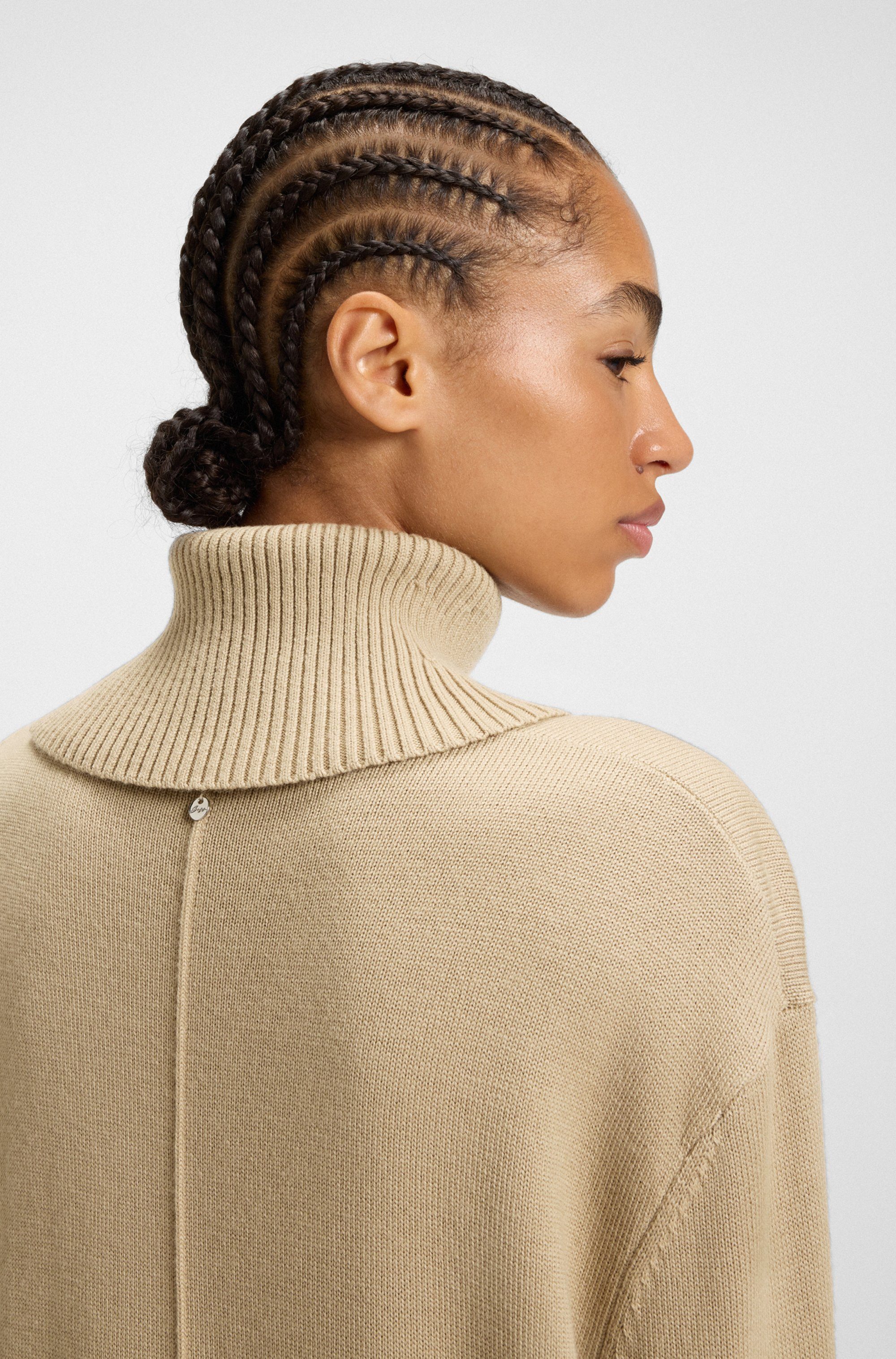 BOSS ORANGE Strickkleid Feringatessa Premium Damenmode Relaxed Fit, mit Schlitzdetails, Turtle Neck