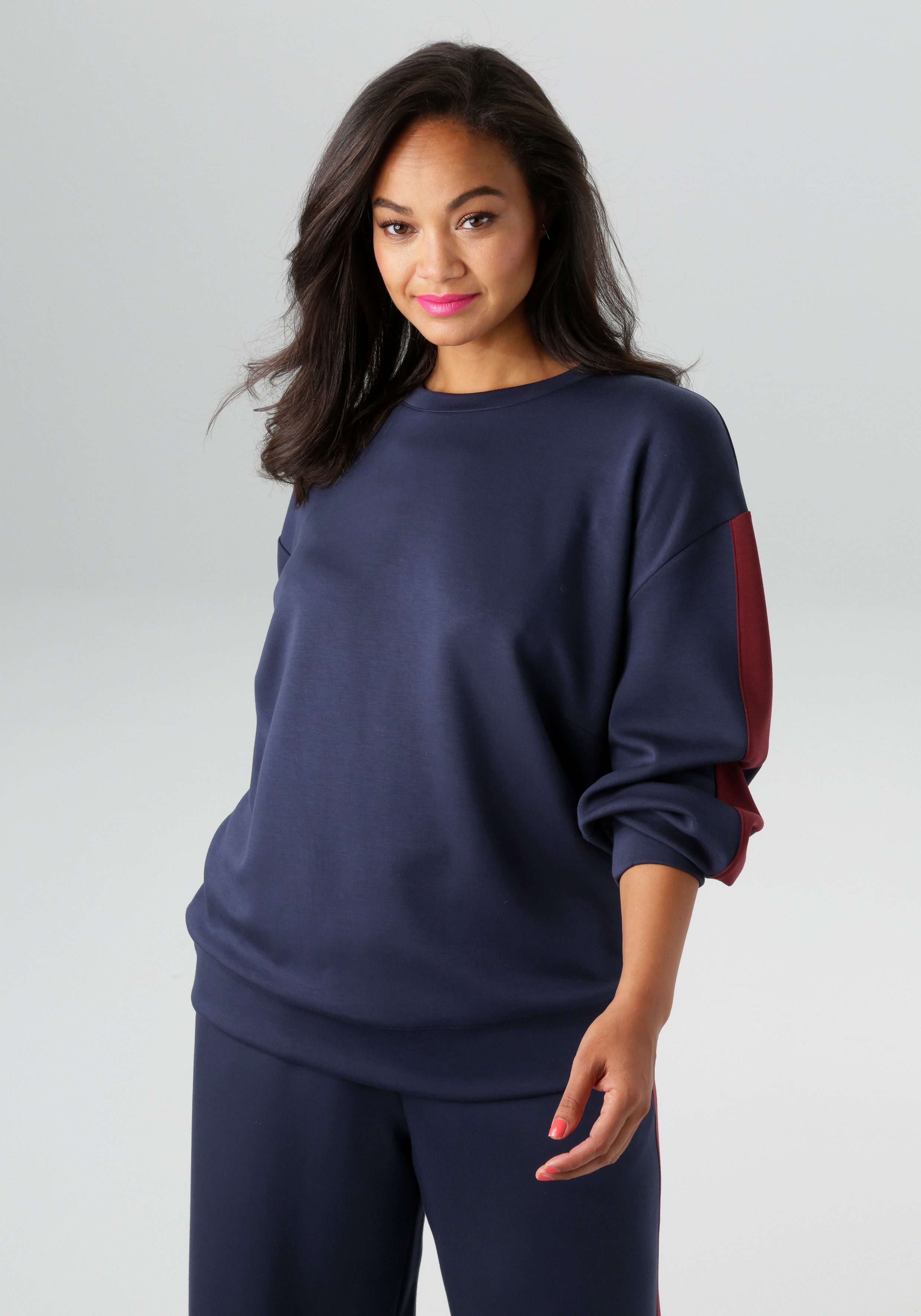 Aniston PLUS Sweatshirt mit trendigen Seitenstreifen günstig online kaufen