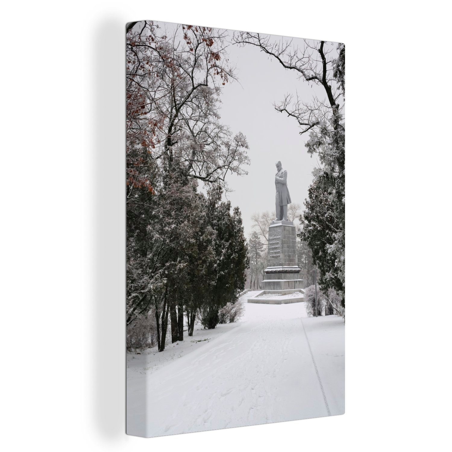 OneMillionCanvasses® Leinwandbild Besonderes Denkmal in einem verschneiten Park von Dnipro in der, (1 St), Leinwandbild fertig bespannt inkl. Zackenaufhänger, Gemälde, 20x30 cm