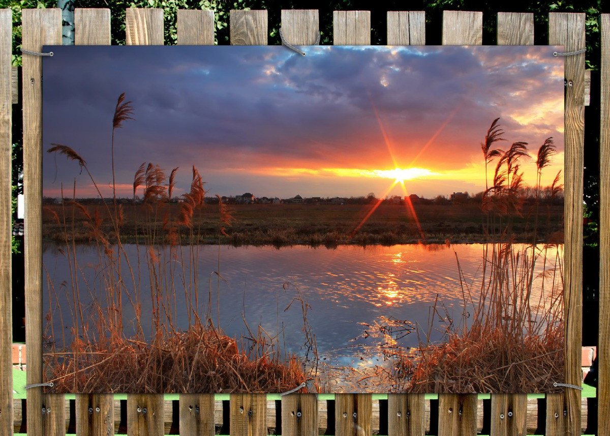 Thumbnail - Wallario Sichtschutzzaunmatten Sonnenuntergang über dem Fluss, Gräser im Wind