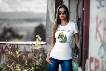 MoonWorks Print-Shirt Damen T-Shirt Fun Motiv kleiner Dino frisst Einhorn Spruch "Wie das Letzte?" Fun-Shirt lustig Moonworks® mit Print