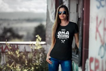 MoonWorks Print-Shirt Damen T-Shirt Koch-Spruch Bei Mama schmeckts am besten! Frauen Fun-Shirt lustig Moonworks® mit Print