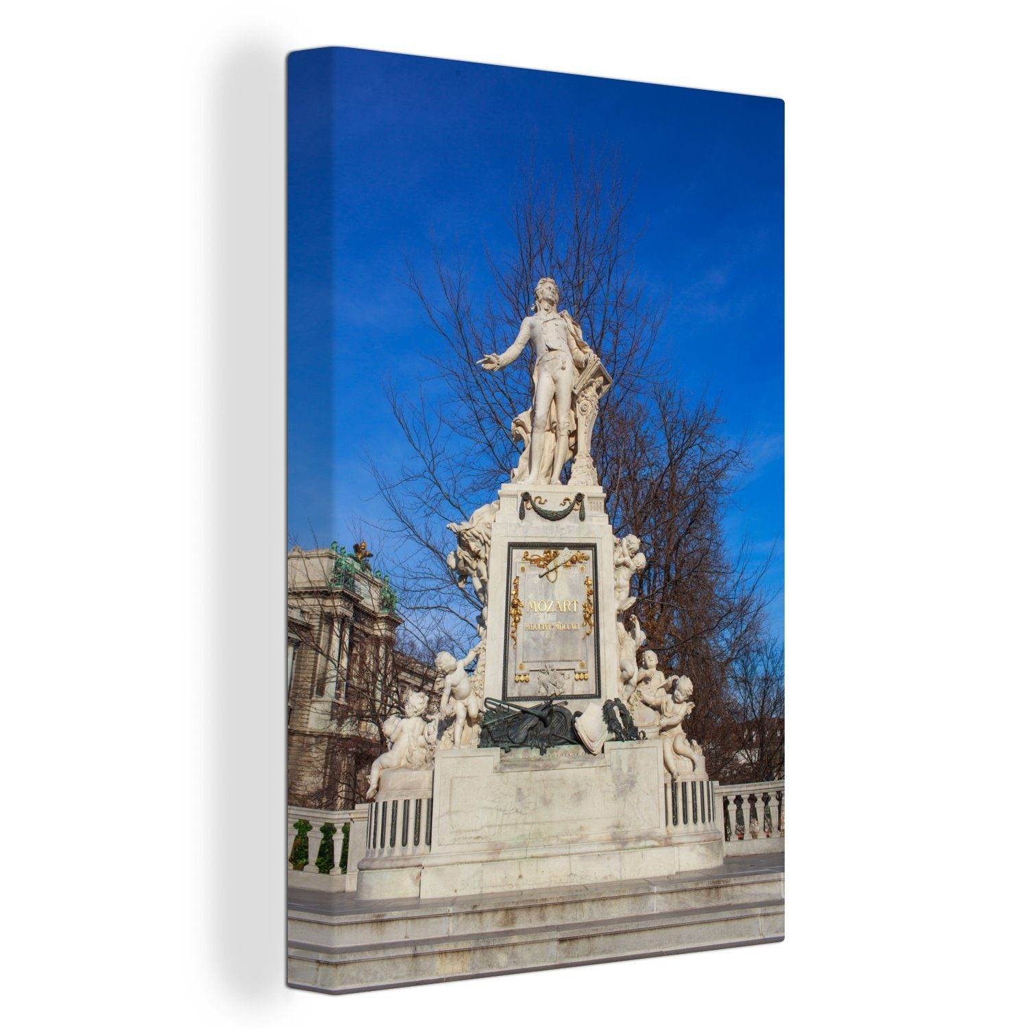 OneMillionCanvasses® Leinwandbild Ein Denkmal für den Komponisten Mozart in Wien an einem strahlenden, (1 St), Leinwandbild fertig bespannt inkl. Zackenaufhänger, Gemälde, 20x30 cm