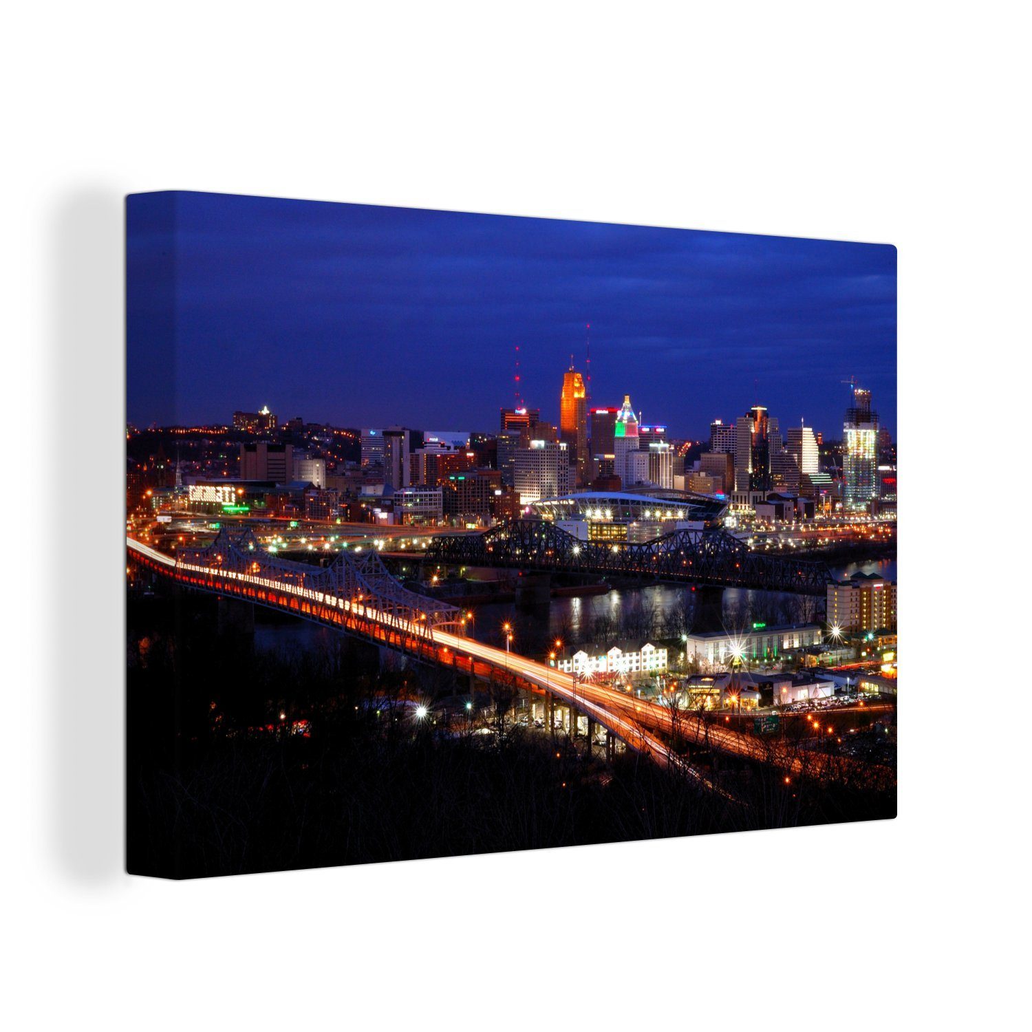 OneMillionCanvasses® Leinwandbild Die Skyline von Cincinnati in den Vereinigten Staaten bei Nacht, (1 St), Wandbild Leinwandbilder, Aufhängefertig, Wanddeko, 30x20 cm