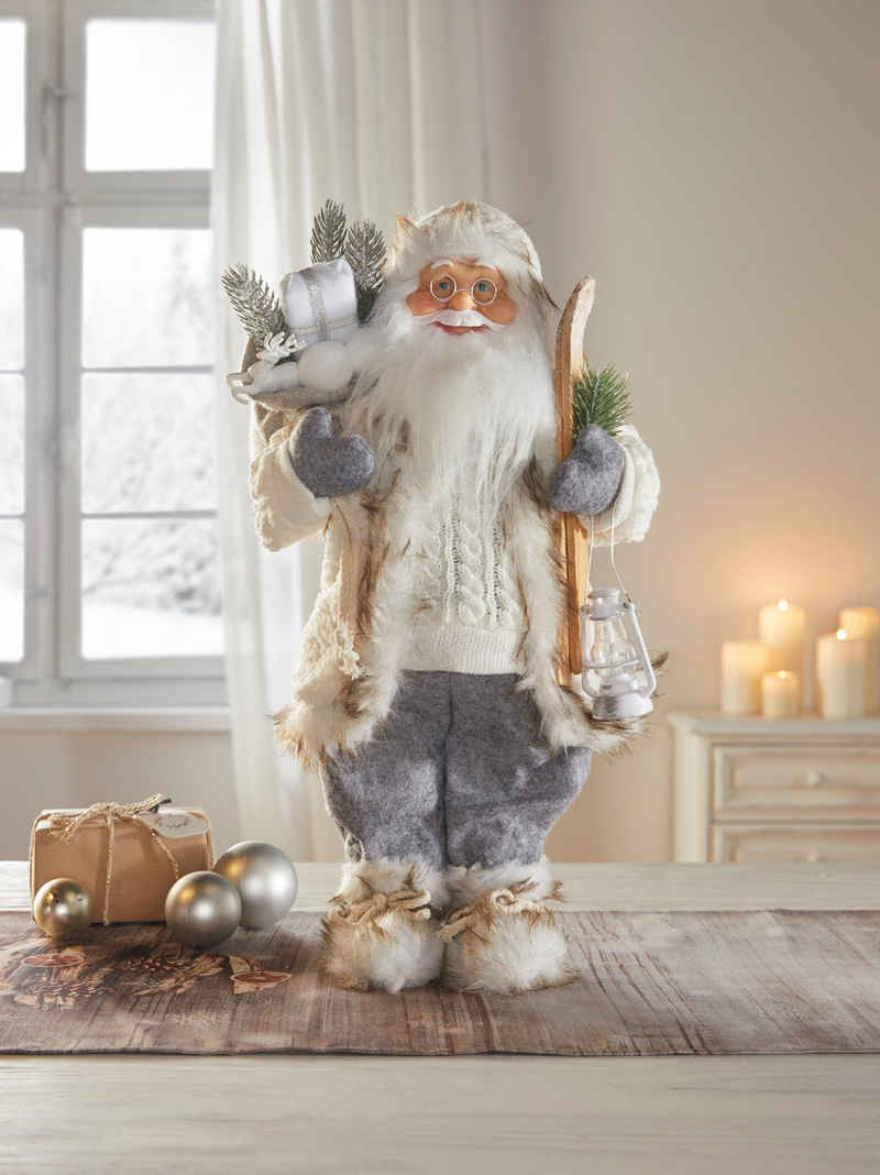 Dekoleidenschaft Weihnachtsmann "Winter" 46 cm hoch, Santa Claus Figur Deko Nikolaus mit Laterne & Ski (1 St), Weihnachtsmannfigur, Christkind, Weihnachtsdeko