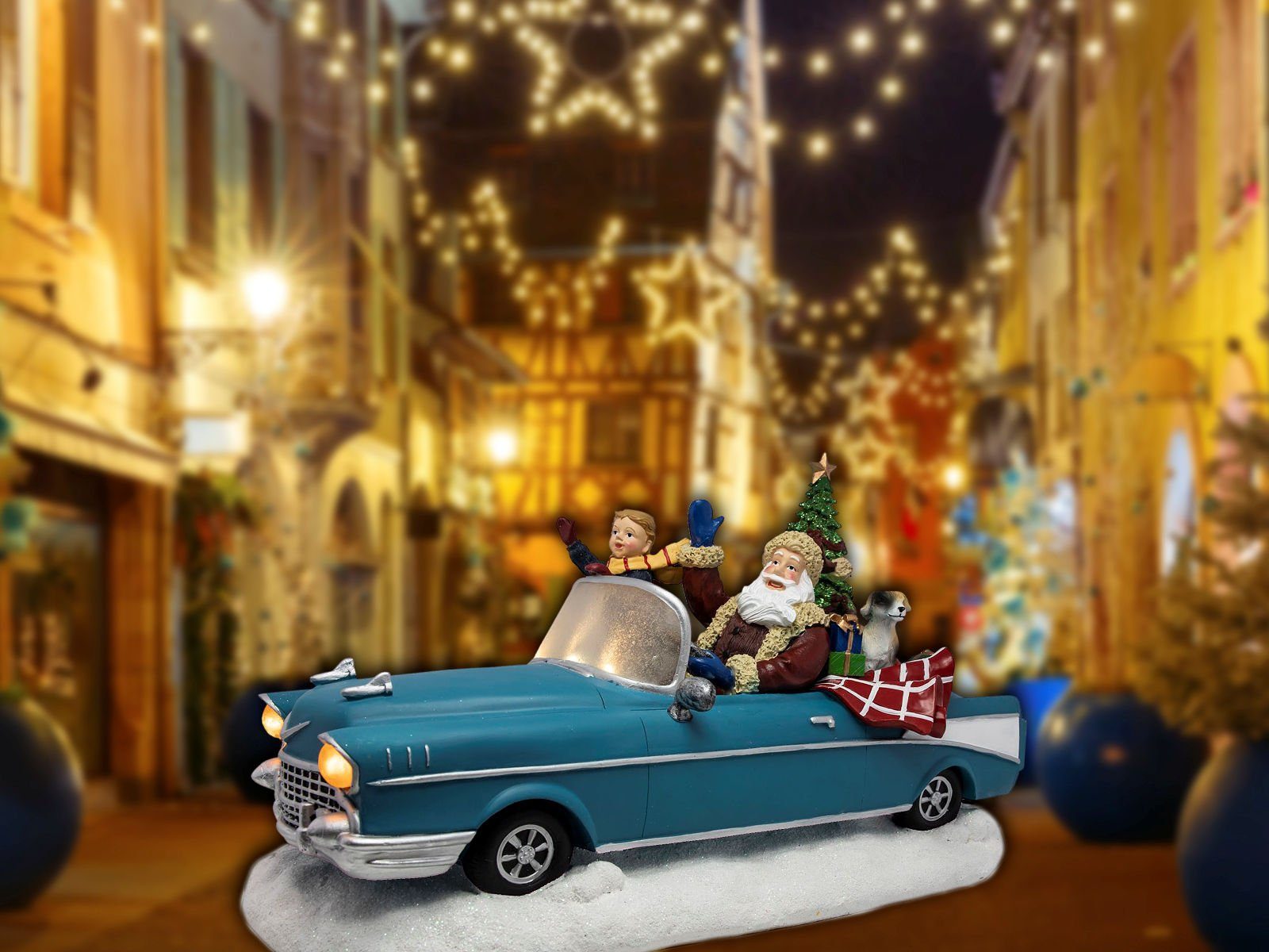 Spetebo Weihnachtsmann Weihnachts Szene Weihnachtsmann im Oldtimer blau, Tisch Deko mit Sound Bewegung und bunter LED Beleuchtung