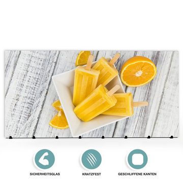 Primedeco Garderobenpaneel Magnetwand und Memoboard aus Glas Eis aus Orange