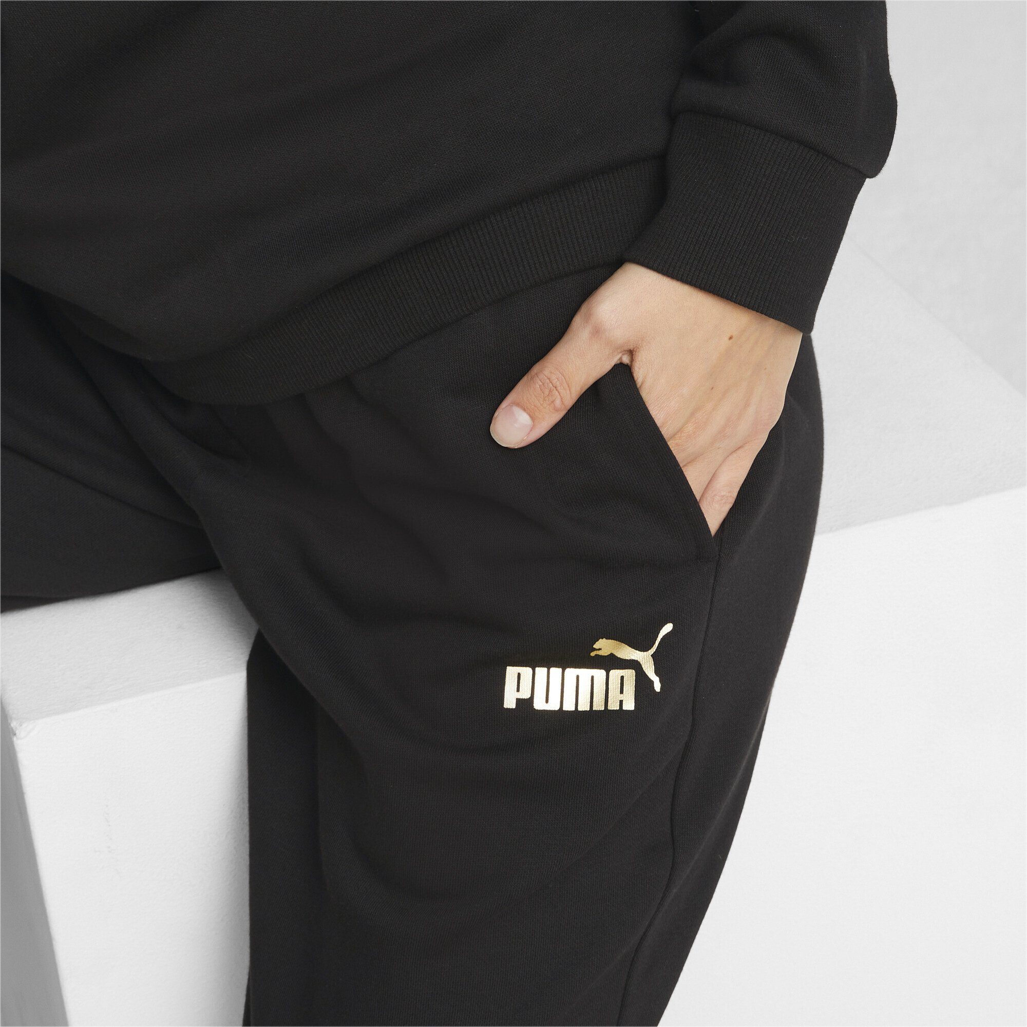 PUMA Sporthose Essentials+ Metallic Black Damen Gold Hose Foil