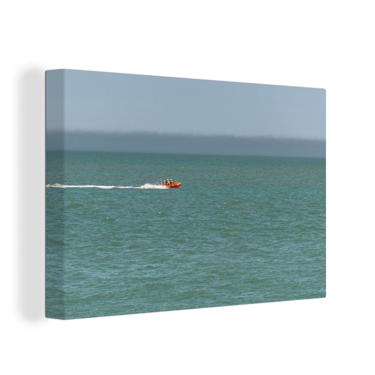 OneMillionCanvasses® Leinwandbild Ein orangefarbenes Rettungsboot in voller Fahrt auf dem Meer, (1 St), Wandbild Leinwandbilder, Aufhängefertig, Wanddeko, 30x20 cm
