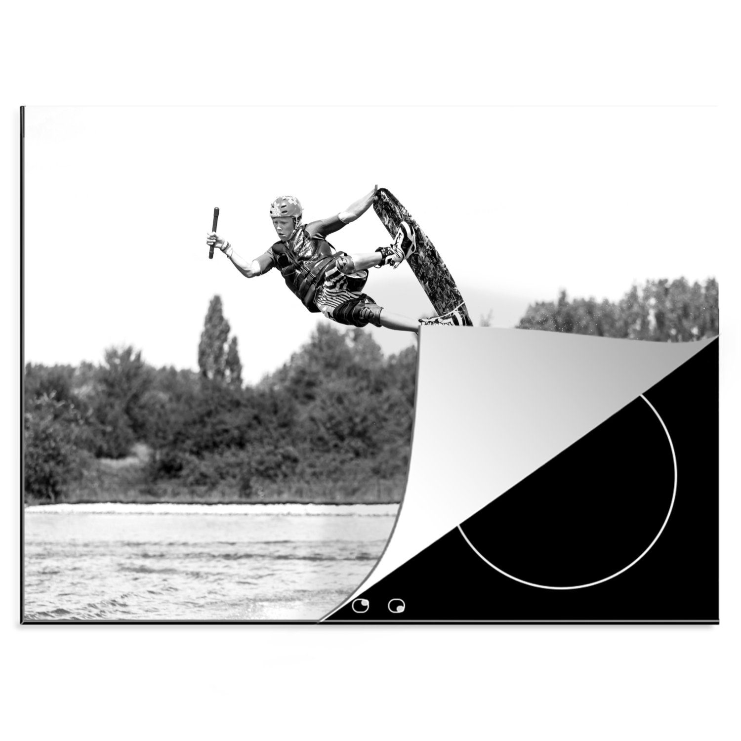 MuchoWow Herdblende-/Abdeckplatte Ein junger und professioneller Wakeboarder springt in die Luft -, Vinyl, (1 tlg), 70x52 cm, Mobile Arbeitsfläche nutzbar, Ceranfeldabdeckung