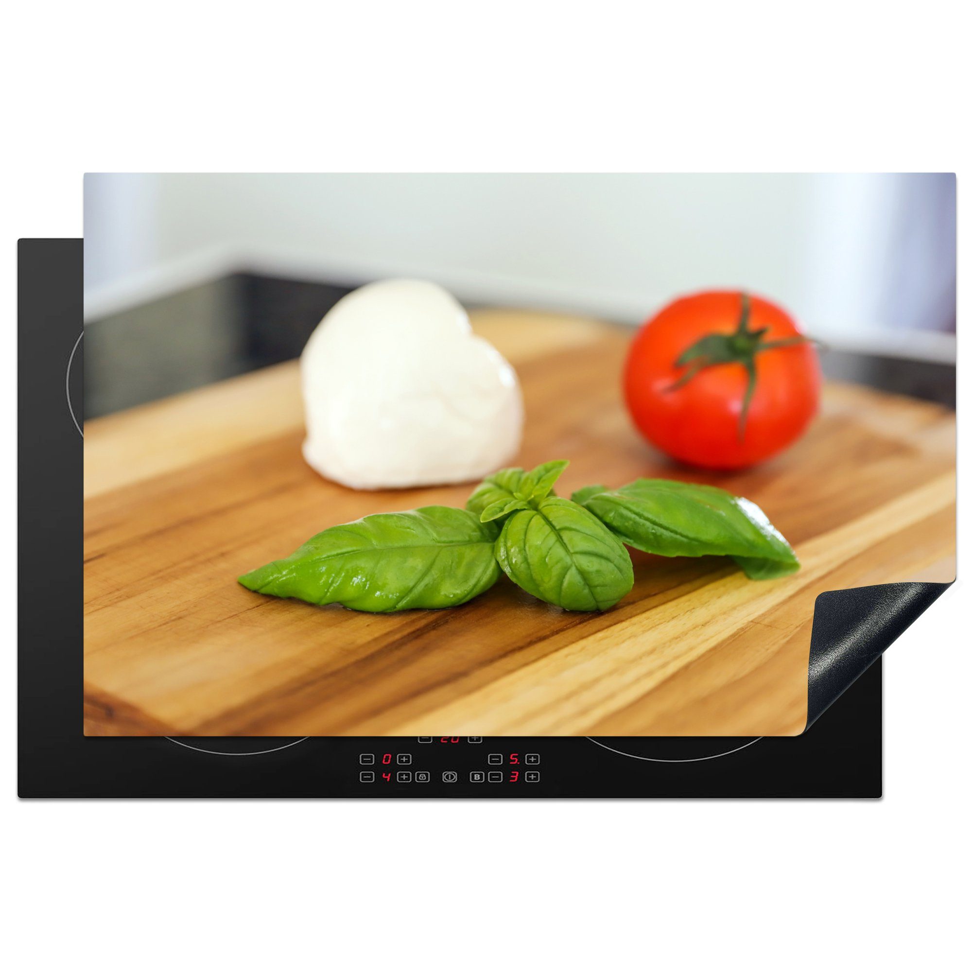 MuchoWow Herdblende-/Abdeckplatte Mozzarella mit Tomate und Basilikum auf einem Schneidebrett, Vinyl, (1 tlg), 81x52 cm, Induktionskochfeld Schutz für die küche, Ceranfeldabdeckung