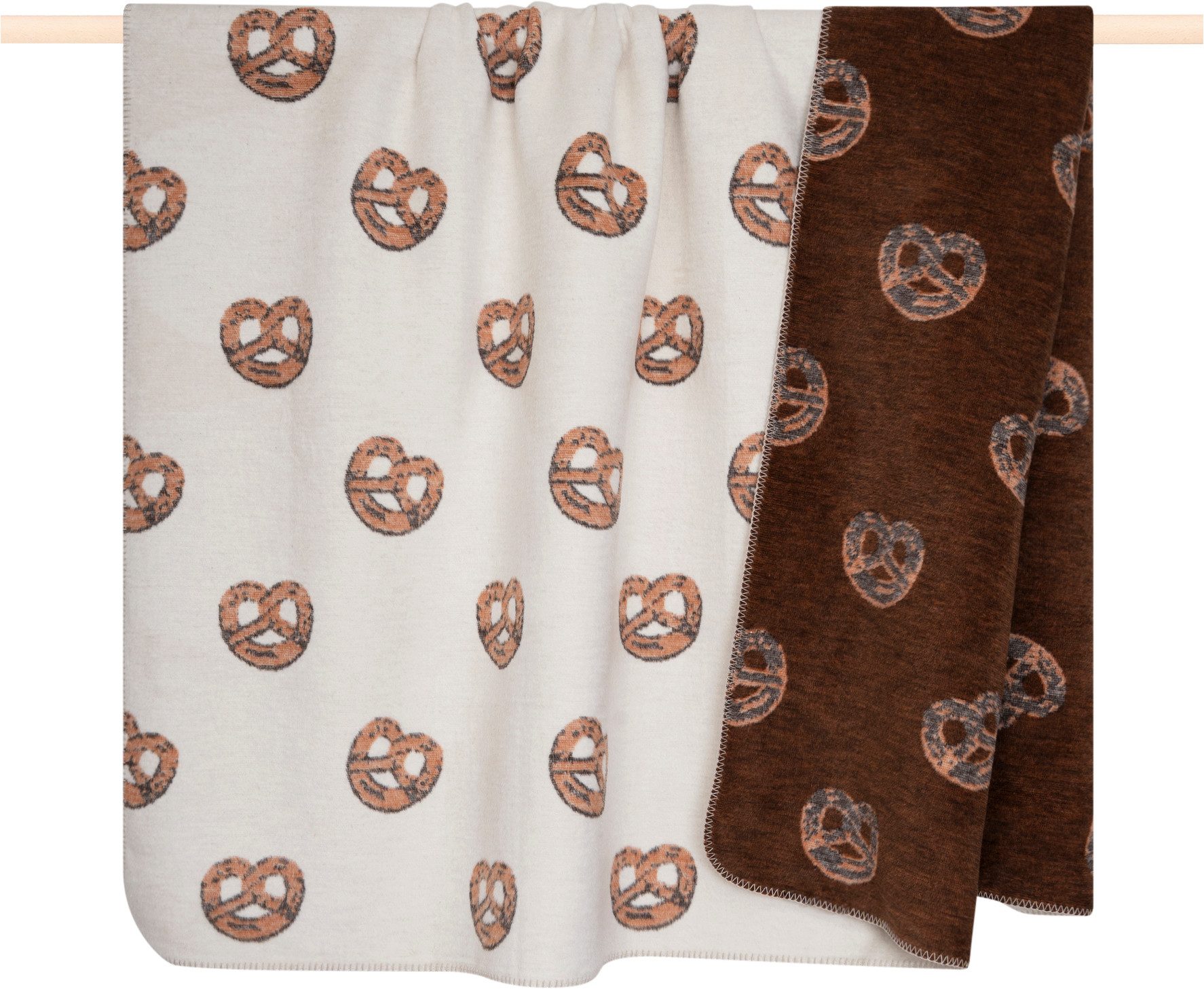 Wohndecke WINTER SPIRIT, PAD, Zwei winterliche Designs in einem Produkt – Brezel und Ski-Szene