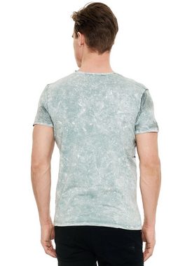 Rusty Neal T-Shirt mit eindrucksvollem Print