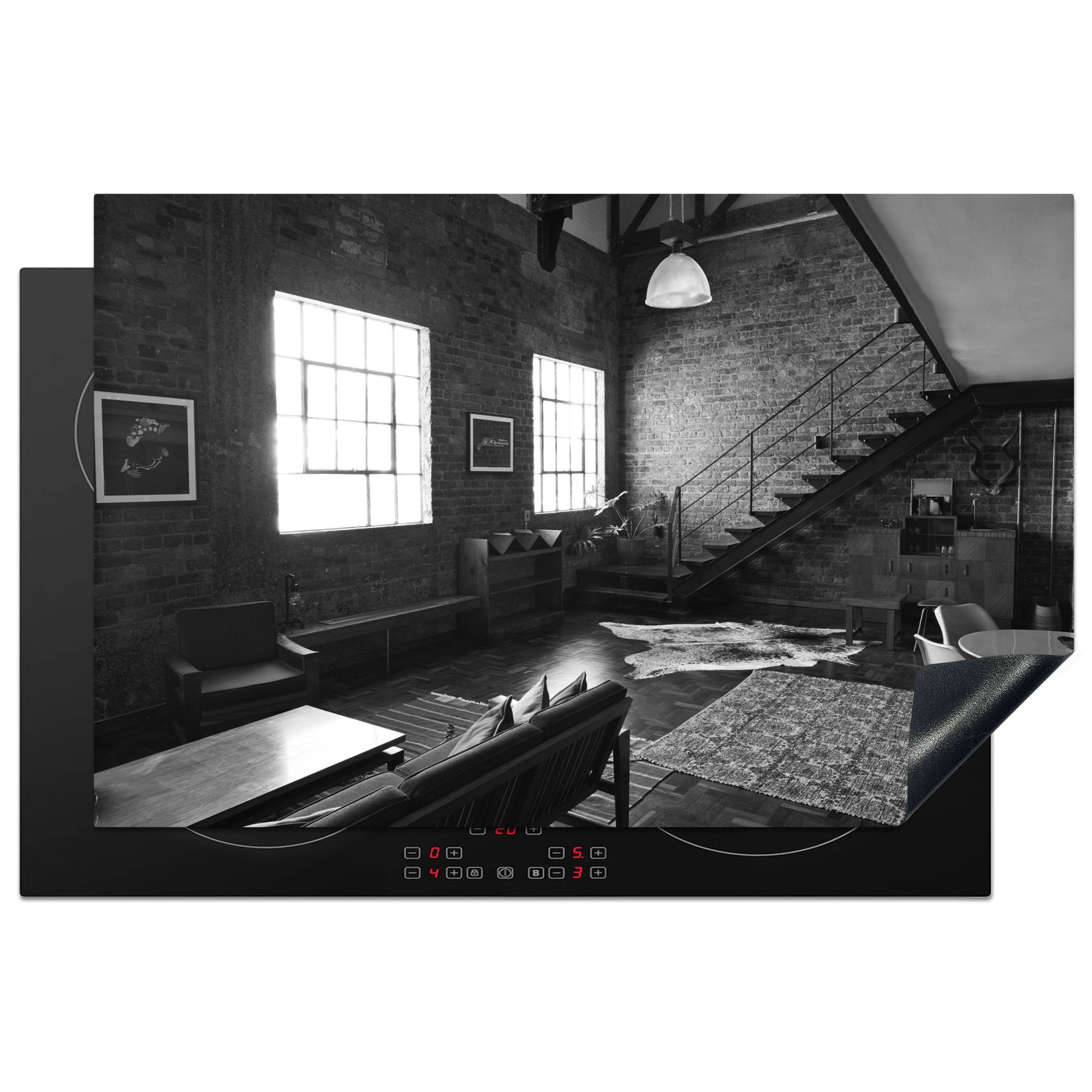 MuchoWow Herdblende-/Abdeckplatte Schwarz-Weiß-Foto einer möblierten Wohnung, Vinyl, (1 tlg), 81x52 cm, Induktionskochfeld Schutz für die küche, Ceranfeldabdeckung