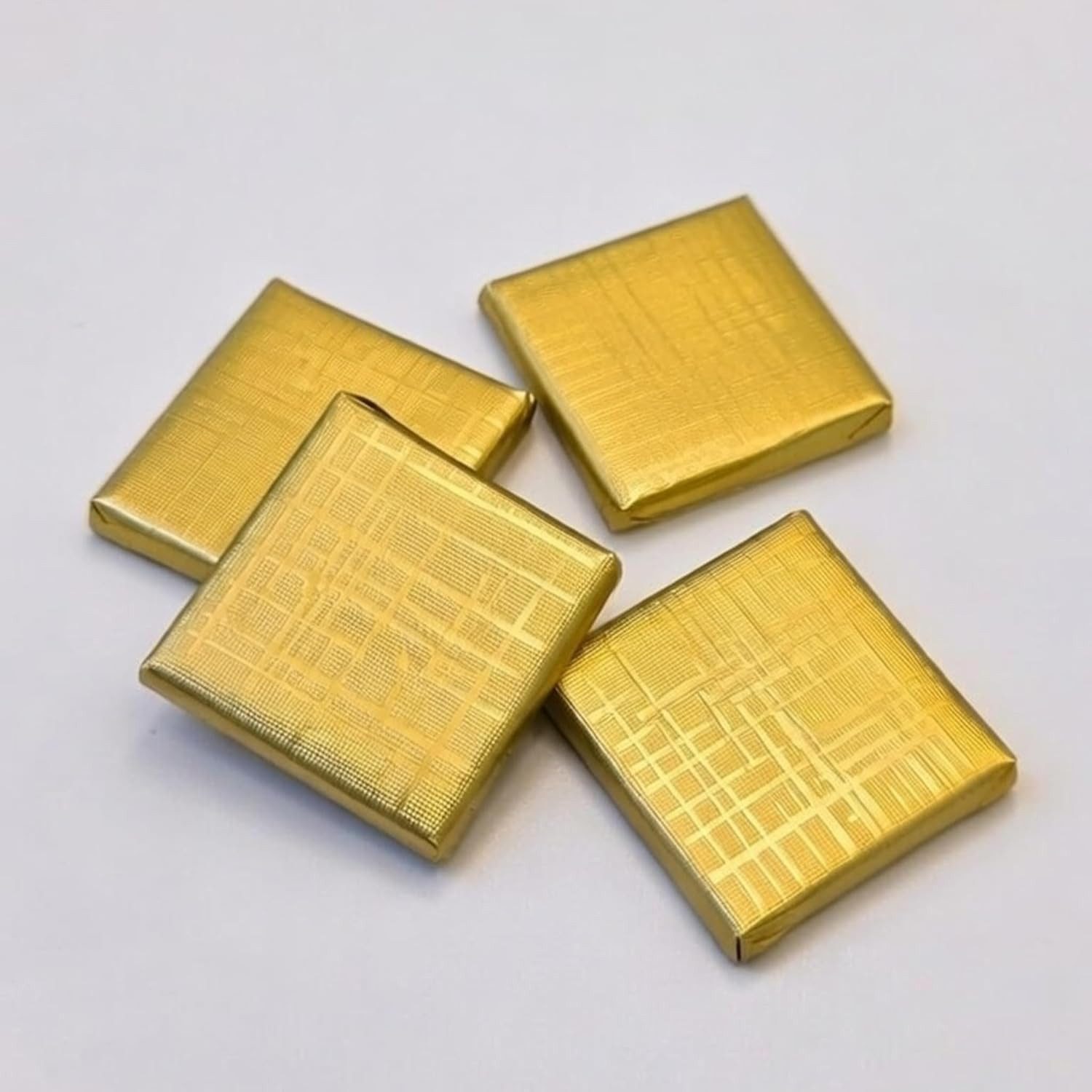 Erya Lounge Schokolade Goldene Madlen Schokolade 4x4cm 1 Kg (ca. 140 - 145 Stück), 1 St.