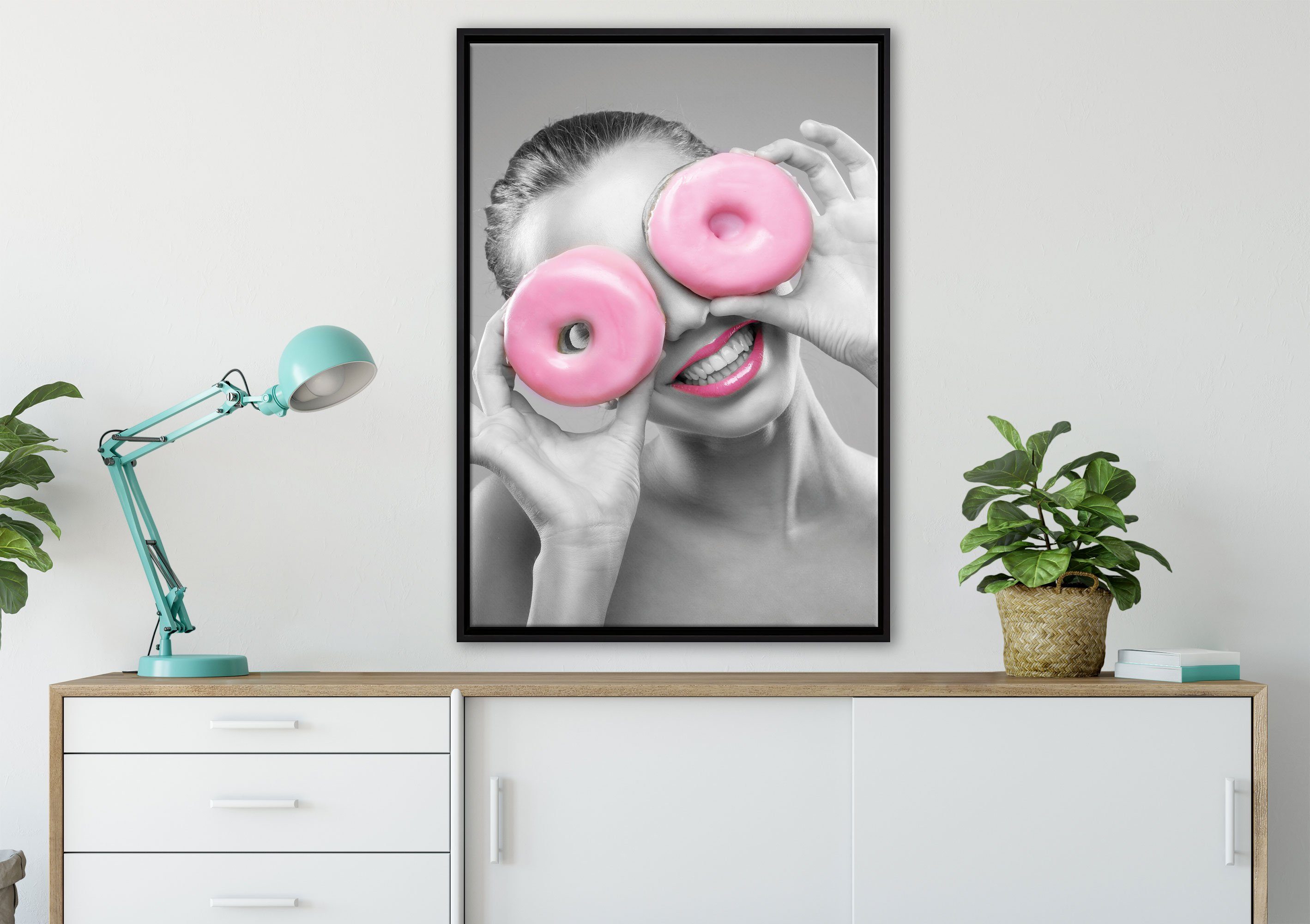 lustige rosa inkl. Pixxprint gefasst, fertig in St), Zackenaufhänger mit bespannt, Donut (1 Augen, Schattenfugen-Bilderrahmen Leinwandbild einem Frau Leinwandbild Wanddekoration