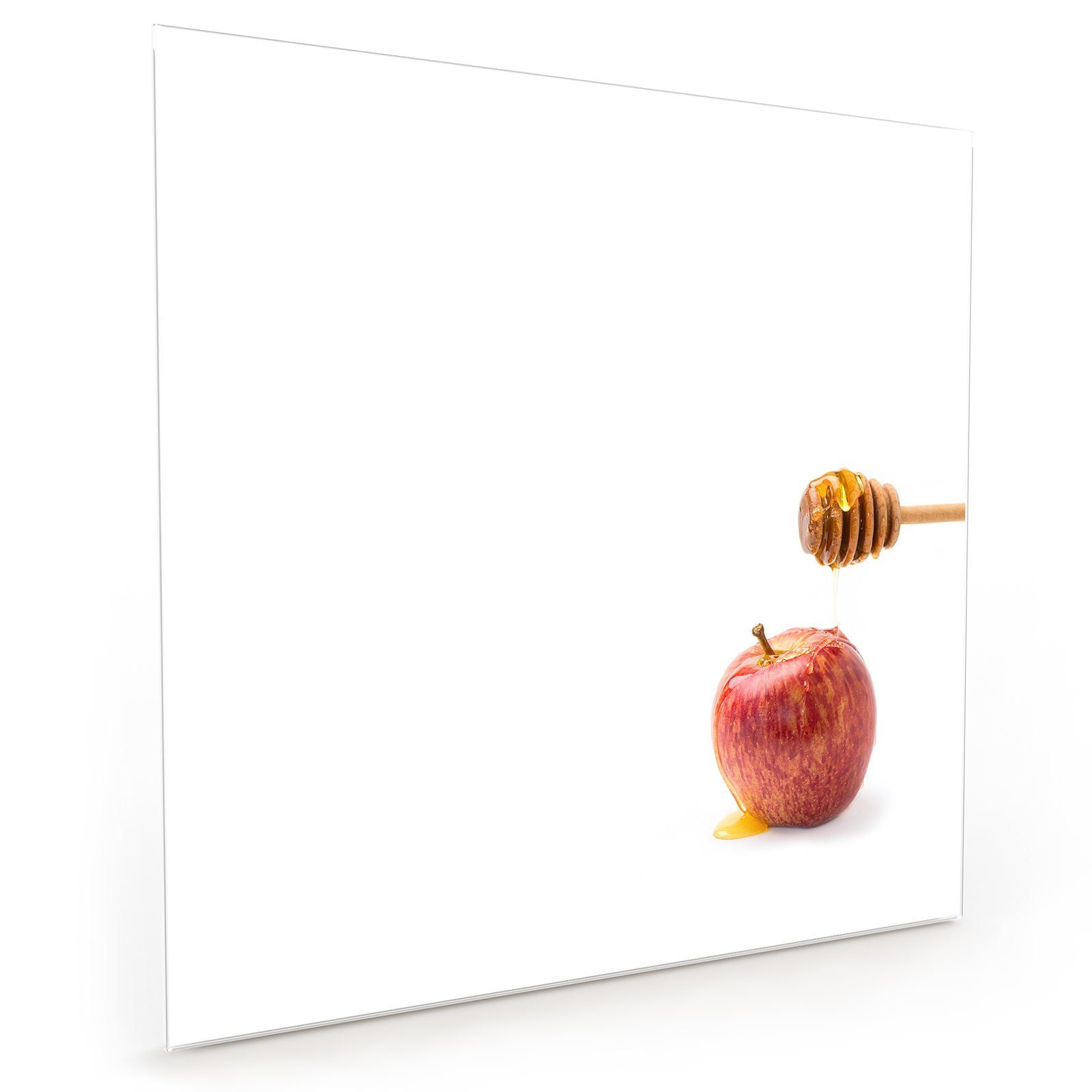 Primedeco Küchenrückwand Spritzschutz Glas Honig tropft auf Apfel