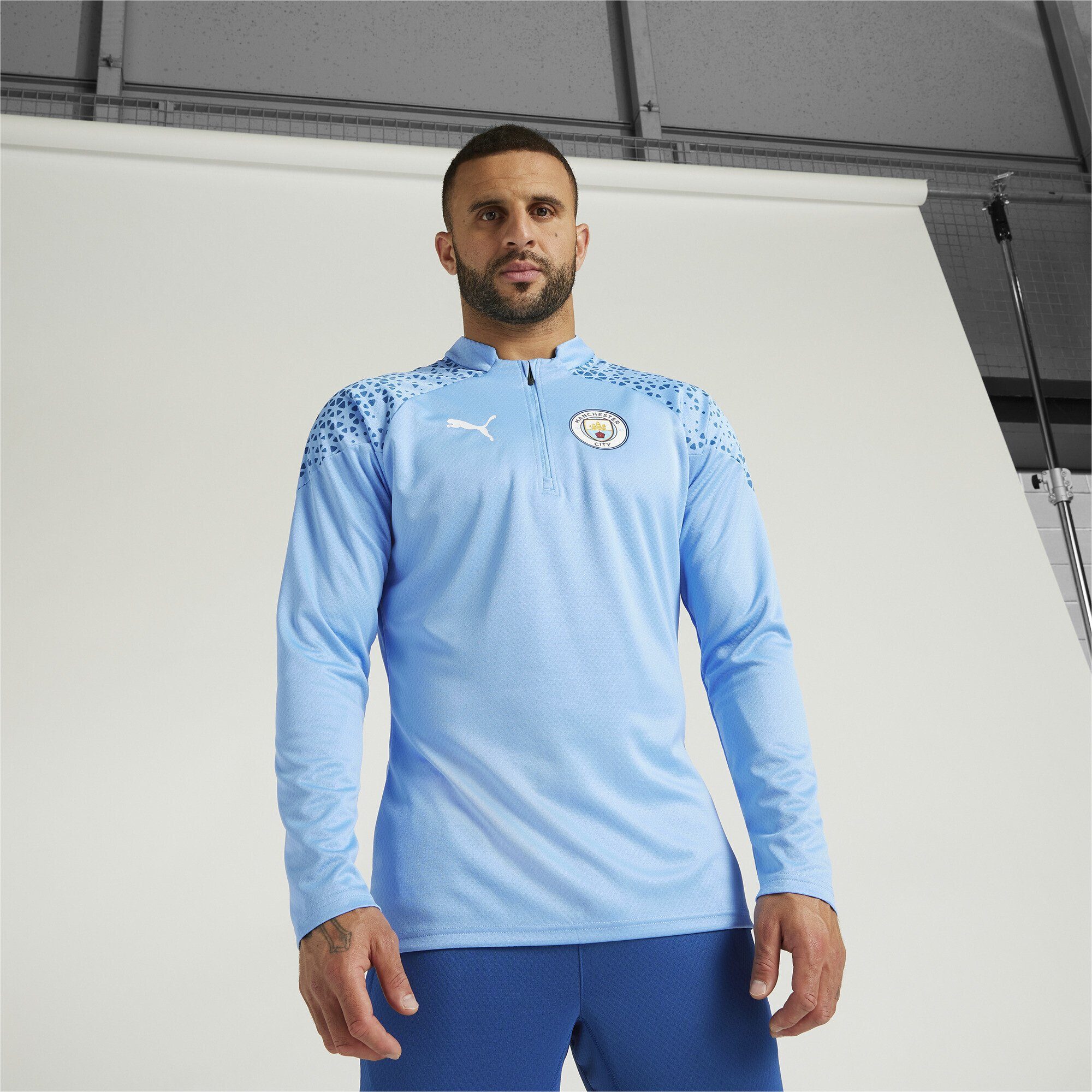 PUMA Trainingsshirt Manchester City Fußball-Trainings-Top Viertelreißverschluss Blue mit Team Light Lake