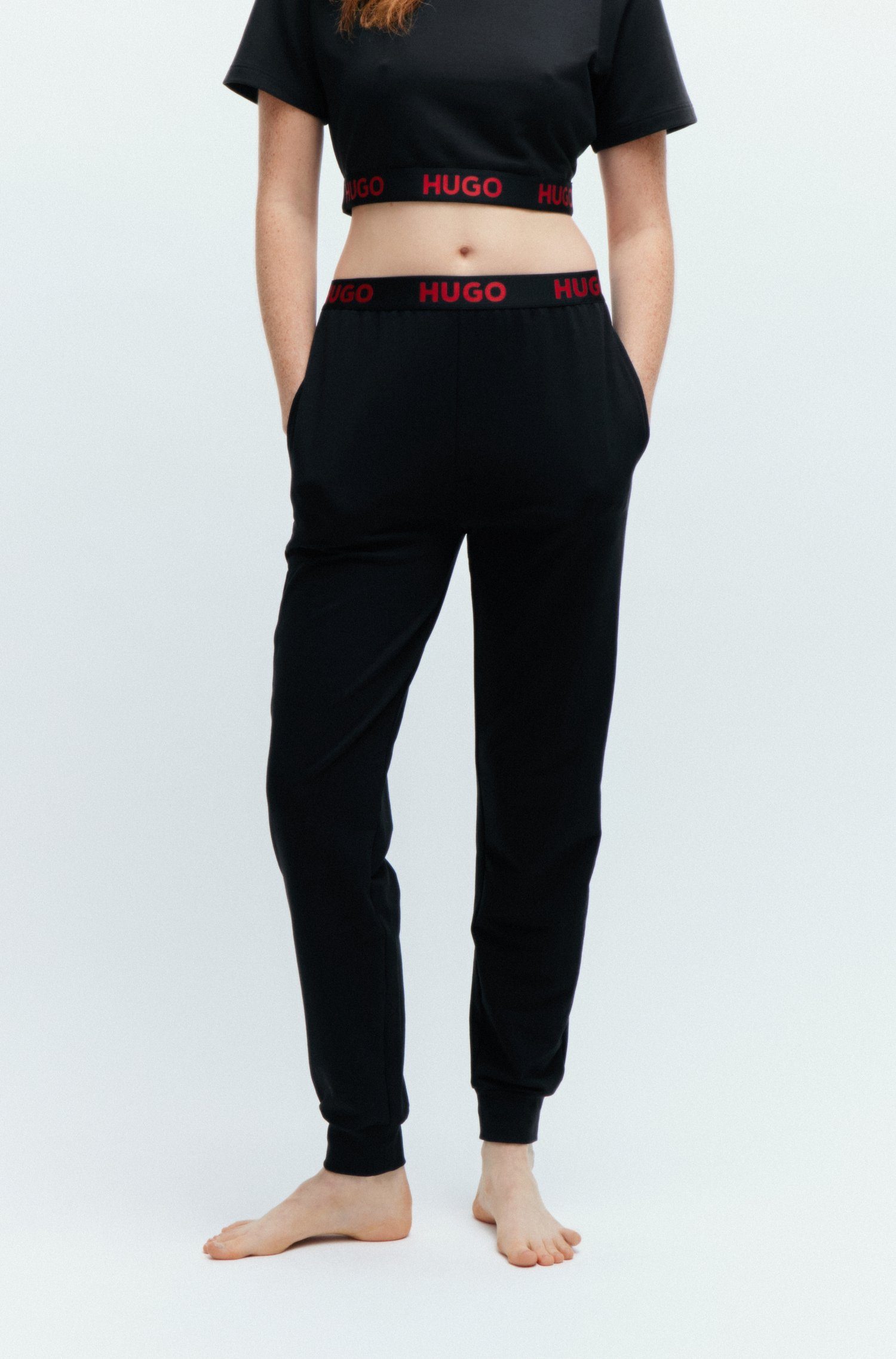 bekannte Marke HUGO Jerseyhose SPORTY LOGO_PANTS mit black Hugo Logo-Elastikbund