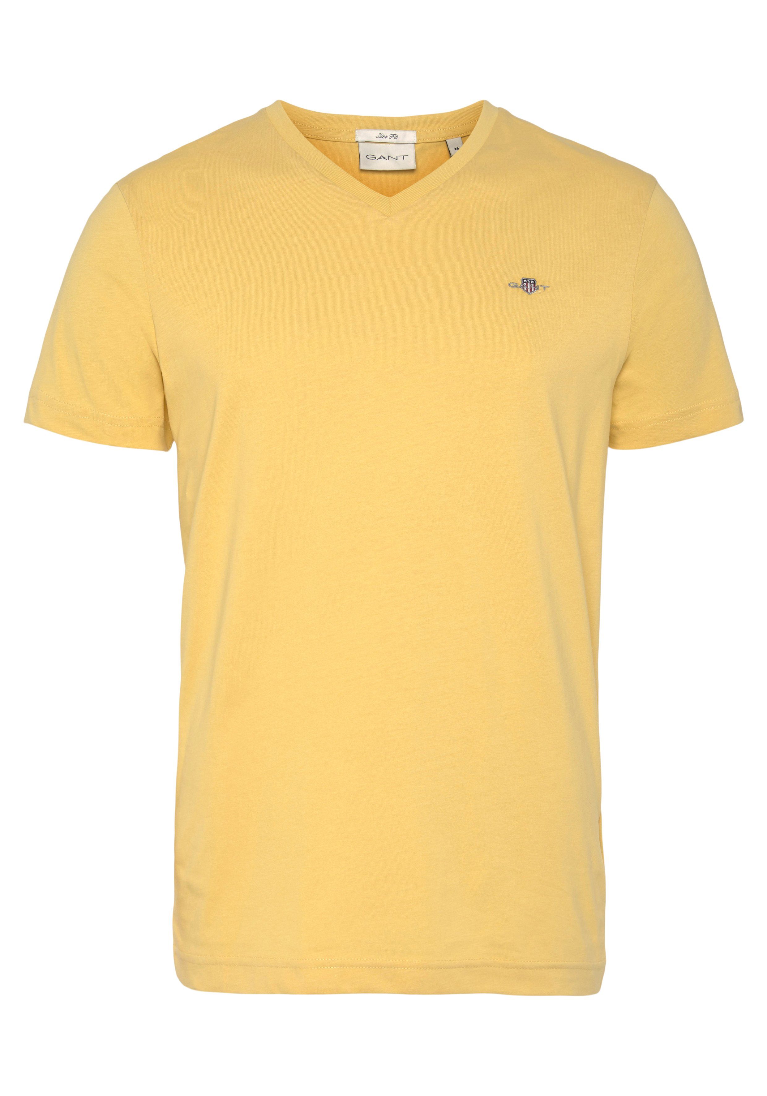 Viele Outlet-Artikel Gant T-Shirt SLIM auf einer der PARCHMENT V-NECK T-SHIRT SHIELD Logostickerei YELLOW Brust kleinen mit