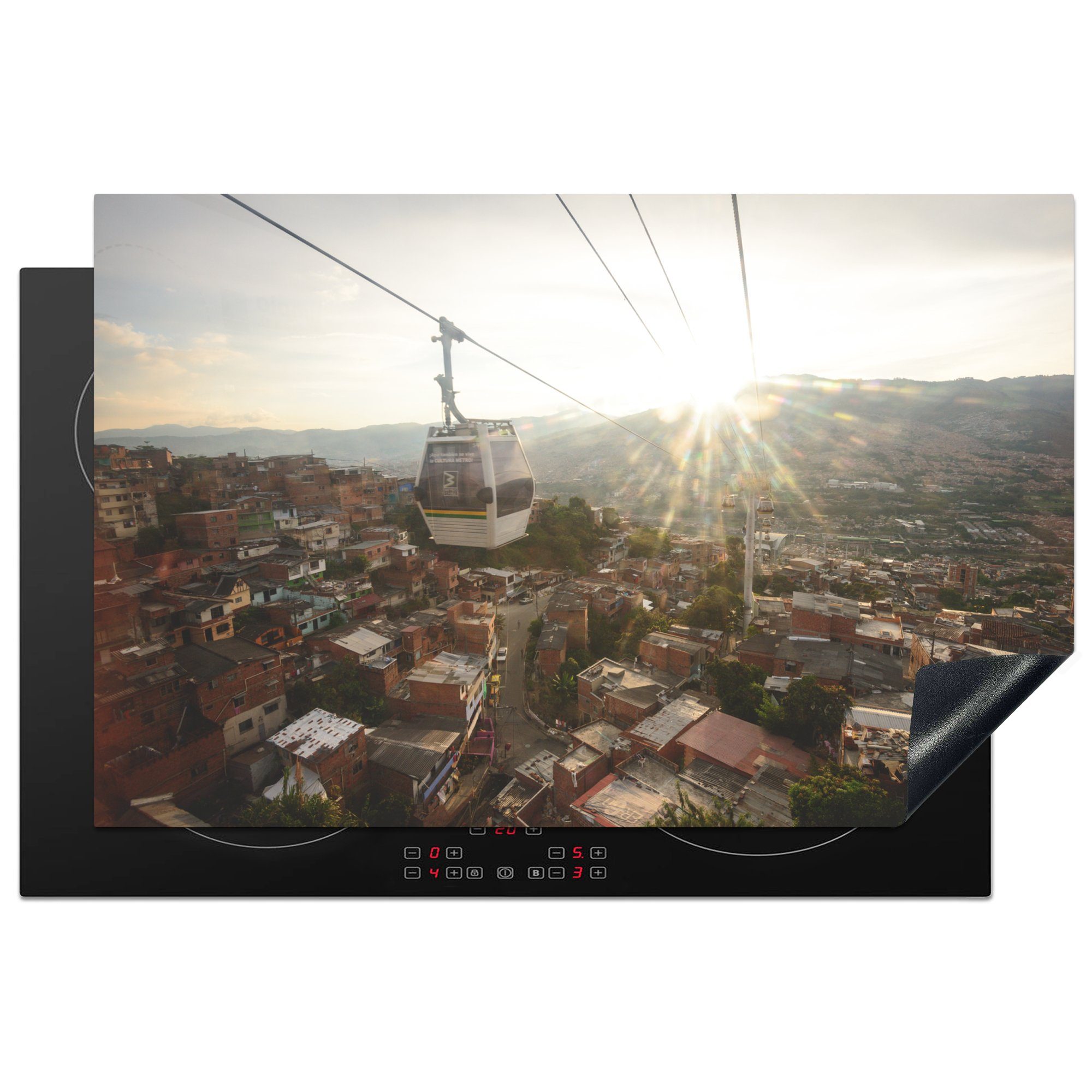 MuchoWow Herdblende-/Abdeckplatte Die Sonne geht hinter der Barrios-Seilbahn in der Nähe von Medellín, Vinyl, (1 tlg), 81x52 cm, Induktionskochfeld Schutz für die küche, Ceranfeldabdeckung