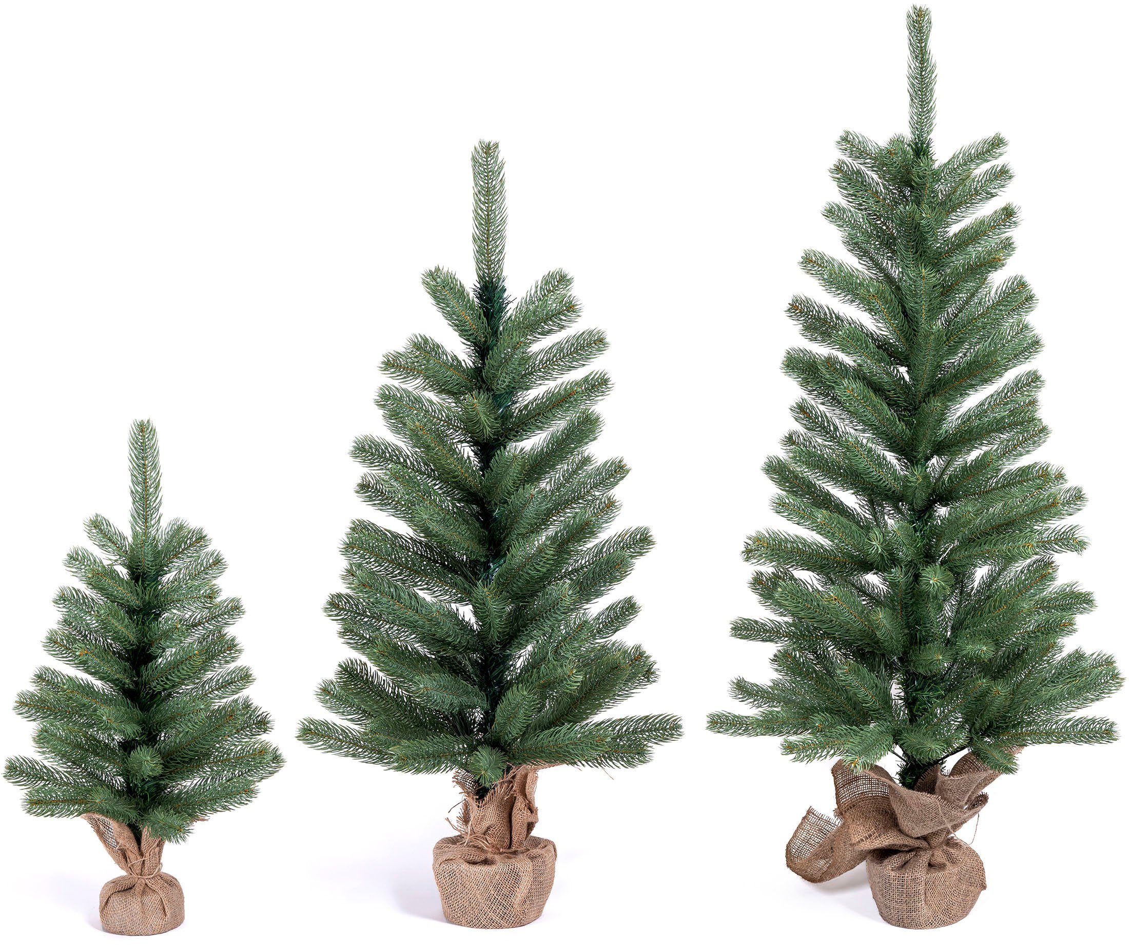 IC Winterworld Künstlicher Weihnachtsbaum Tannenbaum, künstlicher Christbaum, Nordmanntanne, Weihnachtsdeko mit Jutebeutel um den Betonfuß – Bild 4 von 5