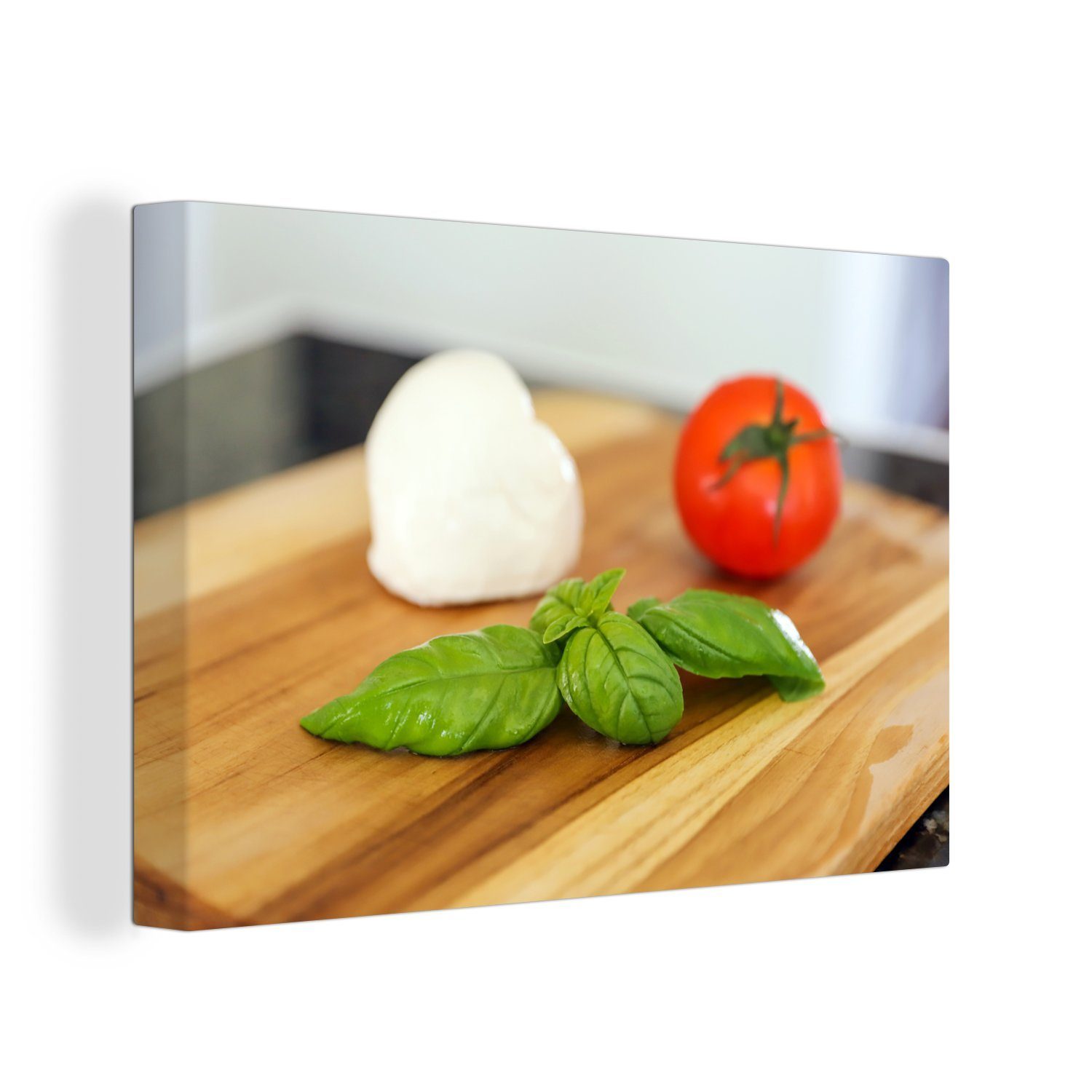 OneMillionCanvasses® Leinwandbild Mozzarella mit Tomate und Basilikum auf einem Schneidebrett, (1 St), Wandbild Leinwandbilder, Aufhängefertig, Wanddeko, 30x20 cm