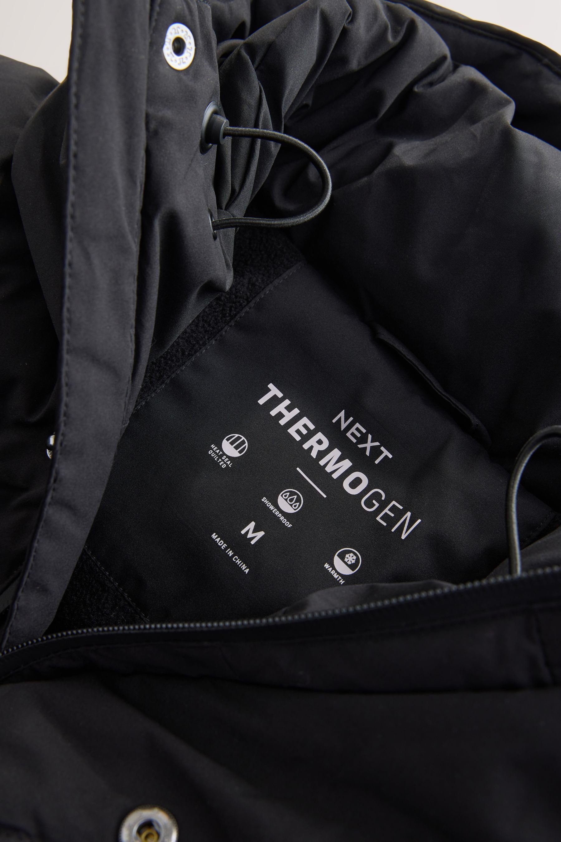 Next Winterjacke Wasserabweisende ThermoGen Pufferjacke, lang (1-St)