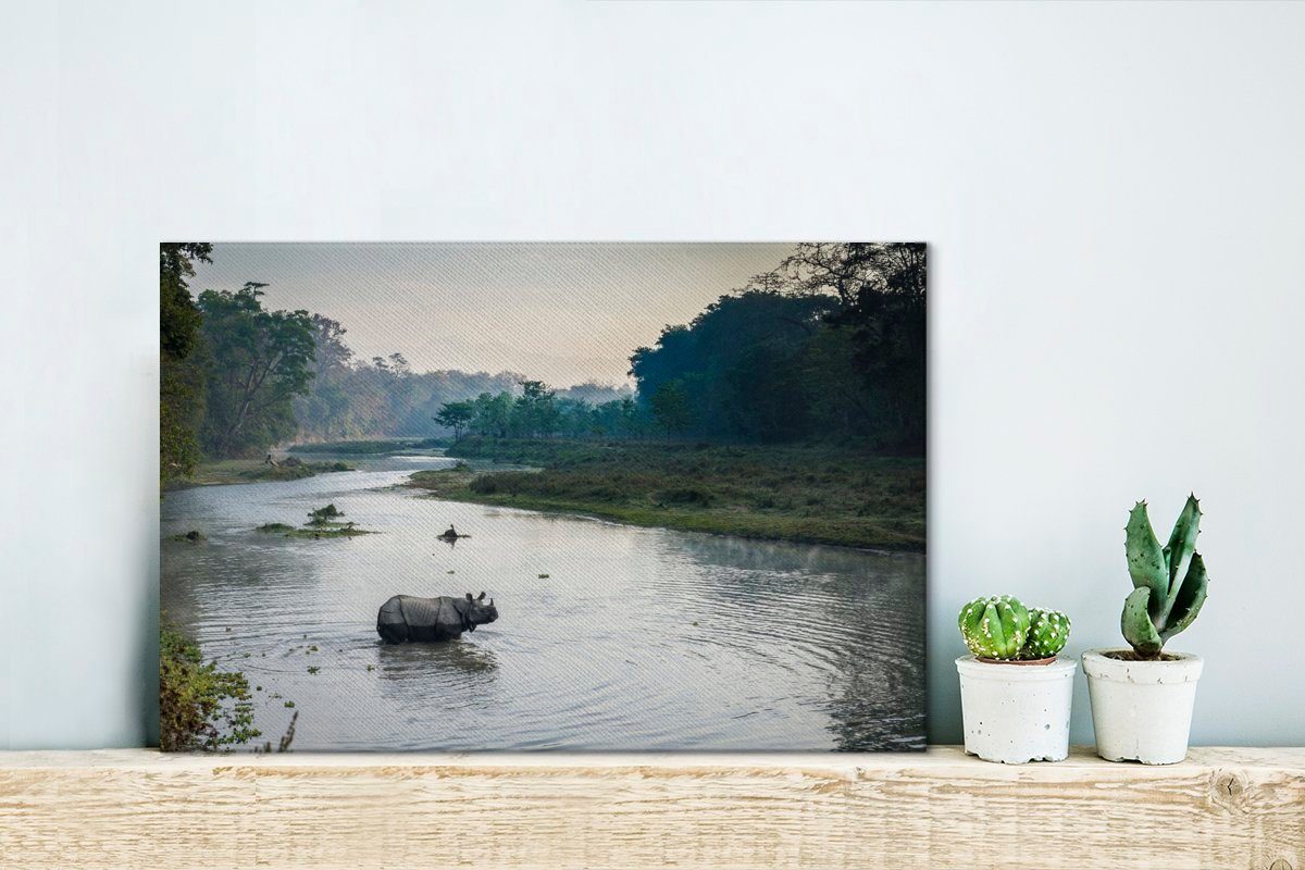 des (1 beim Nepal, cm Flusses 30x20 Leinwandbilder, Chitwan-Nationalpark, OneMillionCanvasses® Nashorn Wanddeko, Überqueren Aufhängefertig, im St), Leinwandbild Wandbild
