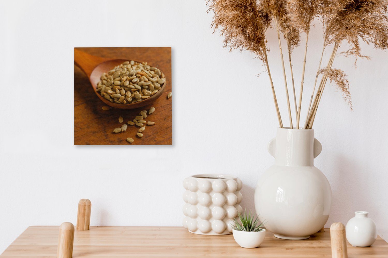 Holztisch, Bilder Leinwandbild Sonnenblumenkernen Schlafzimmer OneMillionCanvasses® für voll St), Wohnzimmer Leinwand auf (1 mit Holzlöffel einem