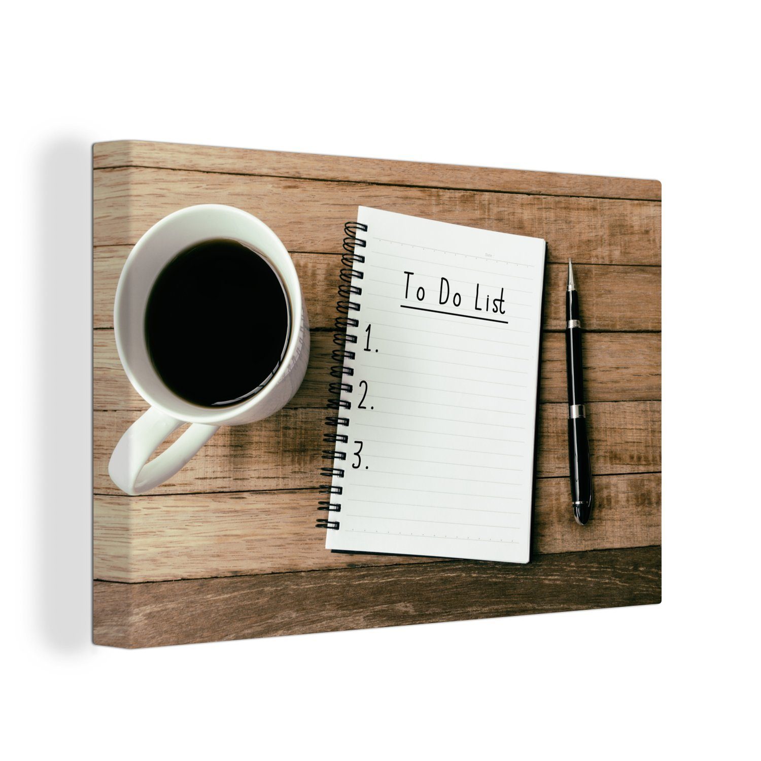 OneMillionCanvasses® Leinwandbild Ein Tagebuch mit einem Stift und Kaffee auf einem hölzernen, (1 St), Wandbild Leinwandbilder, Aufhängefertig, Wanddeko, 30x20 cm