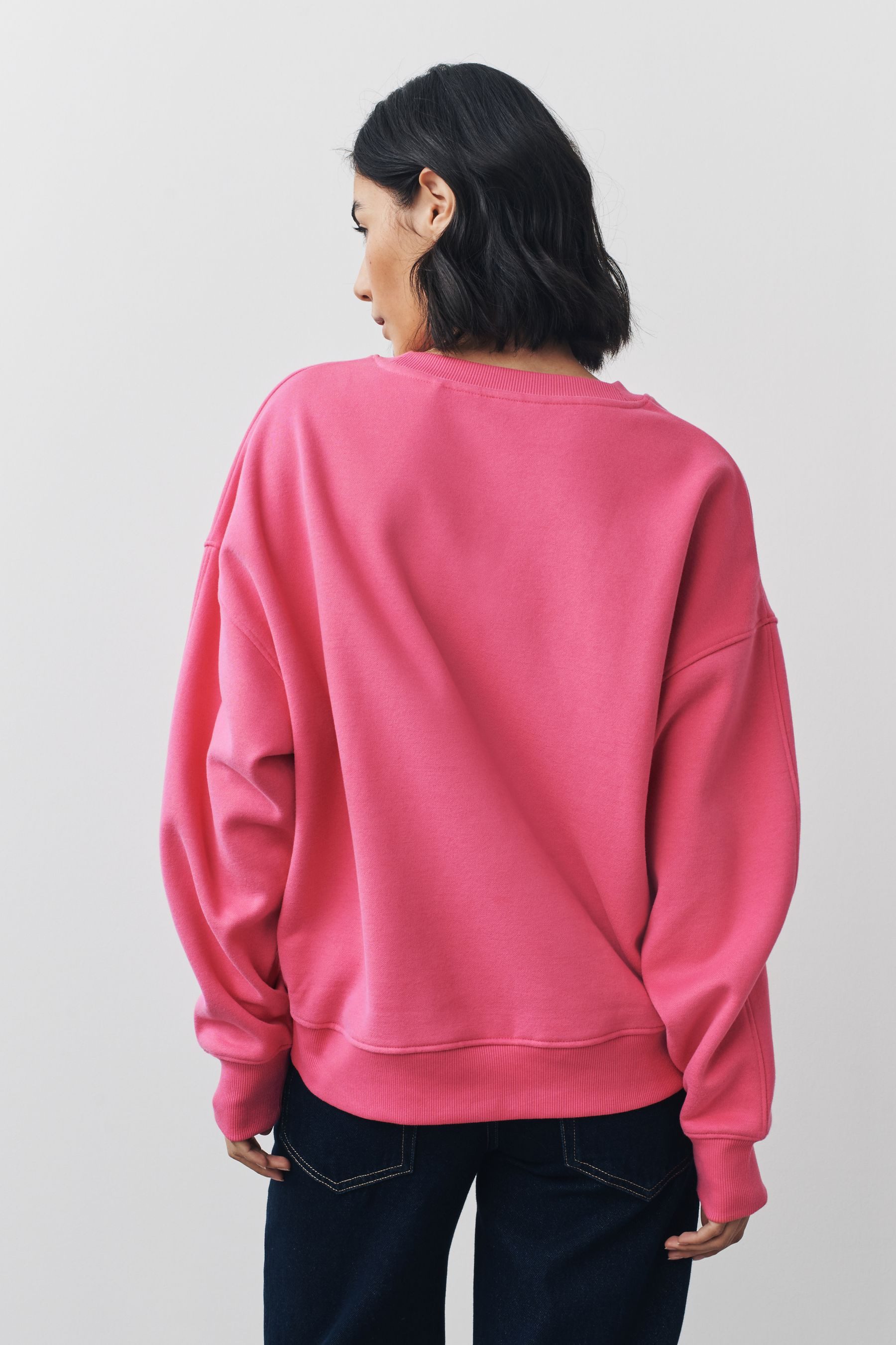 Next Sweater Sweatshirt mit Schleifengrafik + Pailletten (1-tlg) günstig online kaufen