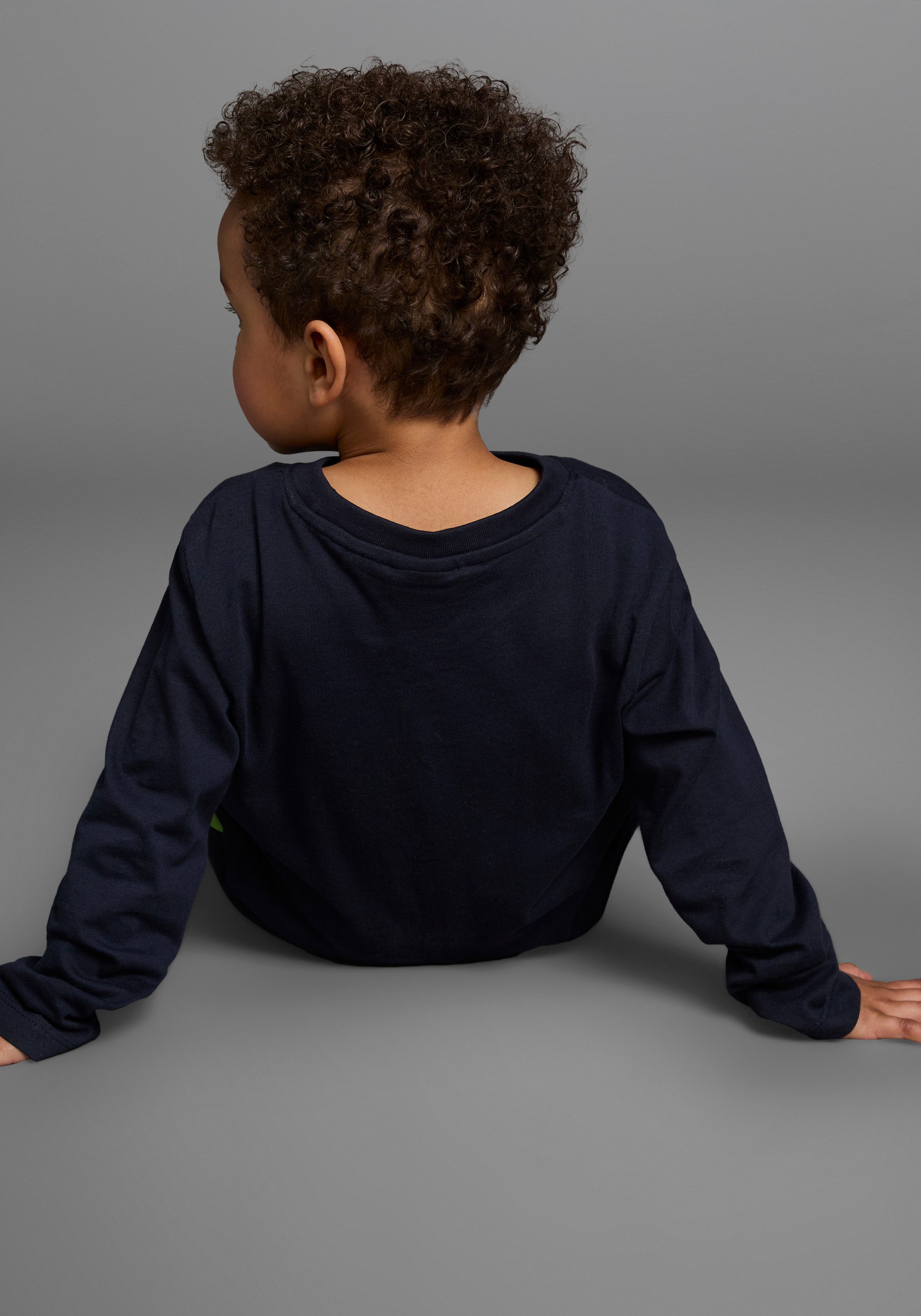 KIDSWORLD Langarmshirt CURIOUS DINO Langarm, Basic-Passform, peppiger Druck