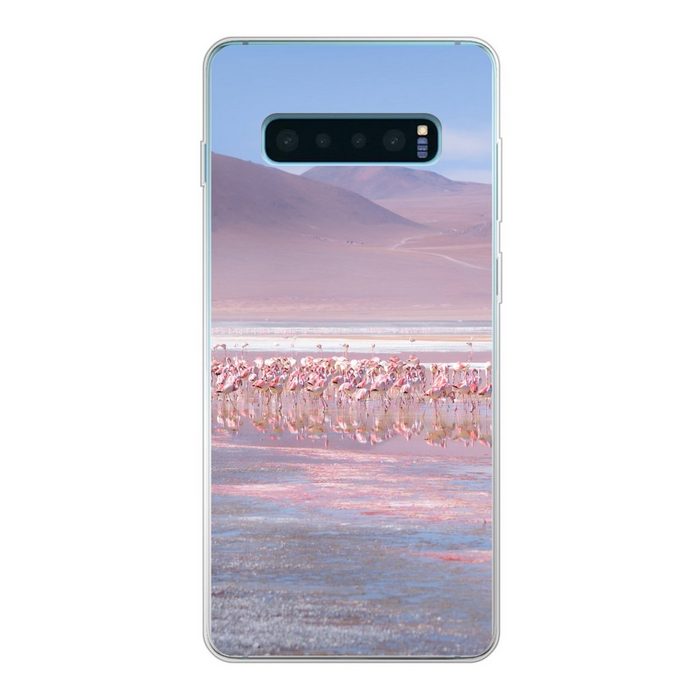 MuchoWow Handyhülle Eine große Gruppe von Flamingos in einer rosa und blauen Landschaft Phone Case Handyhülle Samsung Galaxy S10+ Silikon Schutzhülle