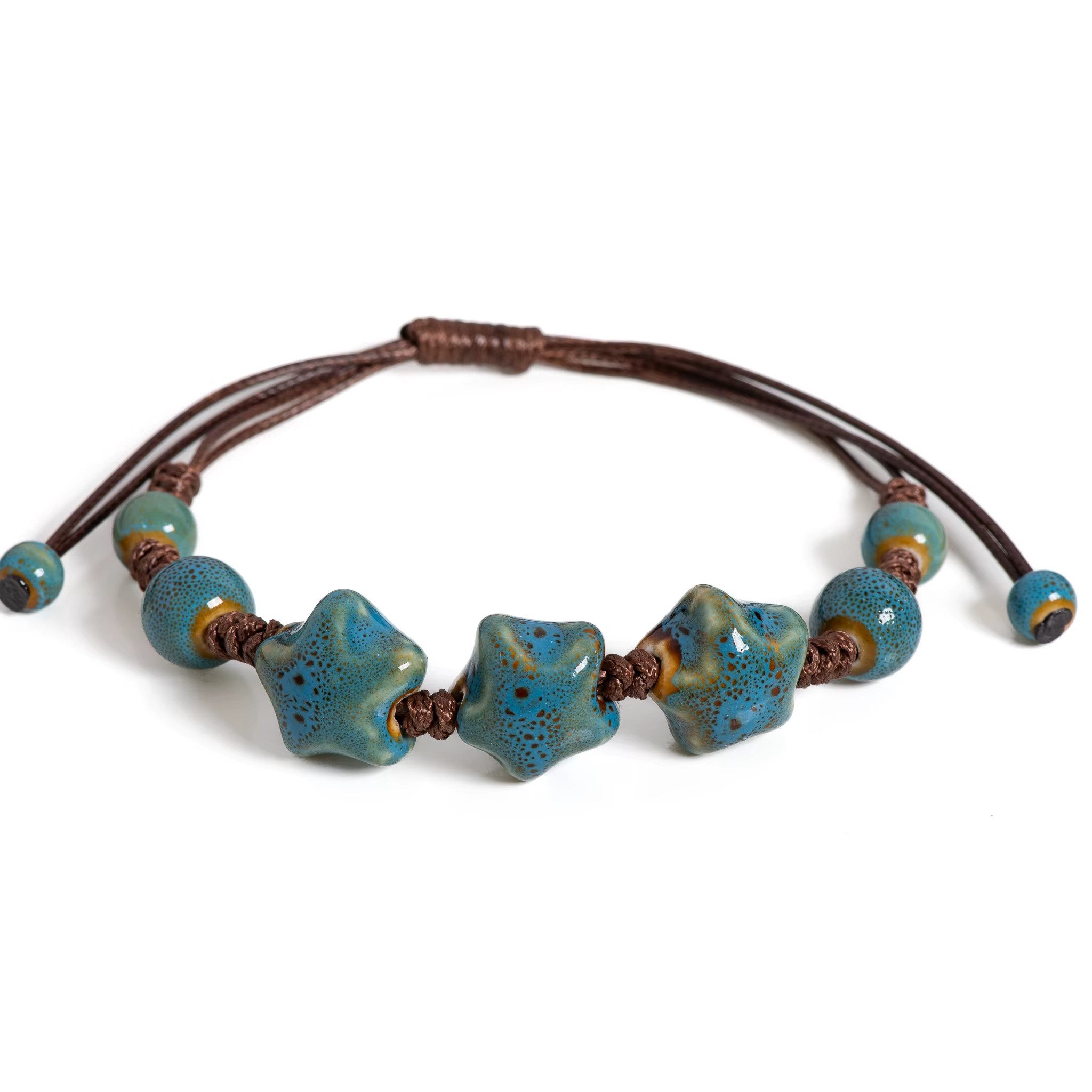 Ware aus aller Welt Armband Handgefertigtes Keramik Armband mit Sternperlen Vintage Charme (1-tlg)