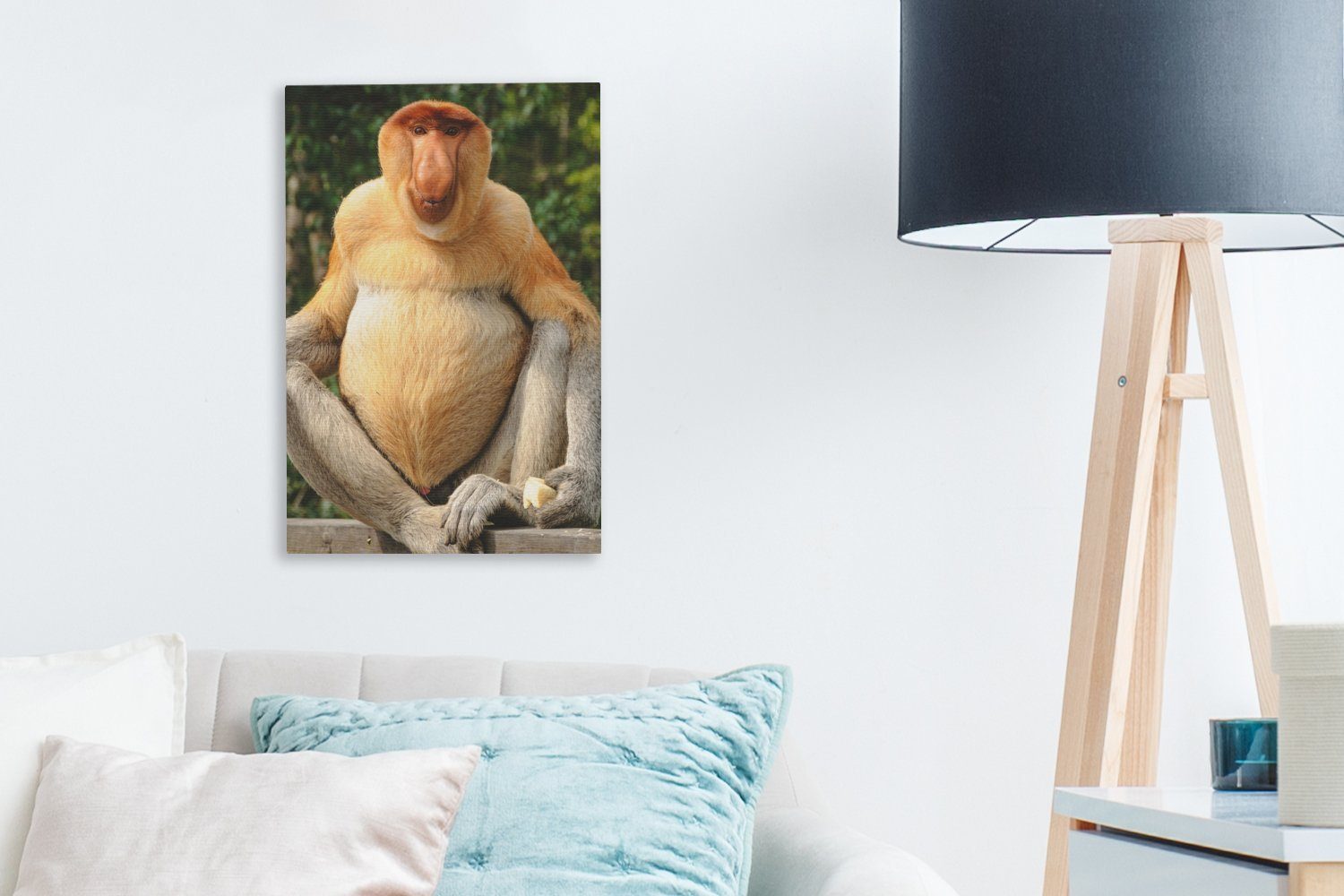 OneMillionCanvasses® Leinwandbild Ein Proboscis-Affe auf fertig Gemälde, Leinwandbild einem 20x30 St), cm bespannt Zackenaufhänger, inkl. (1 Zaun